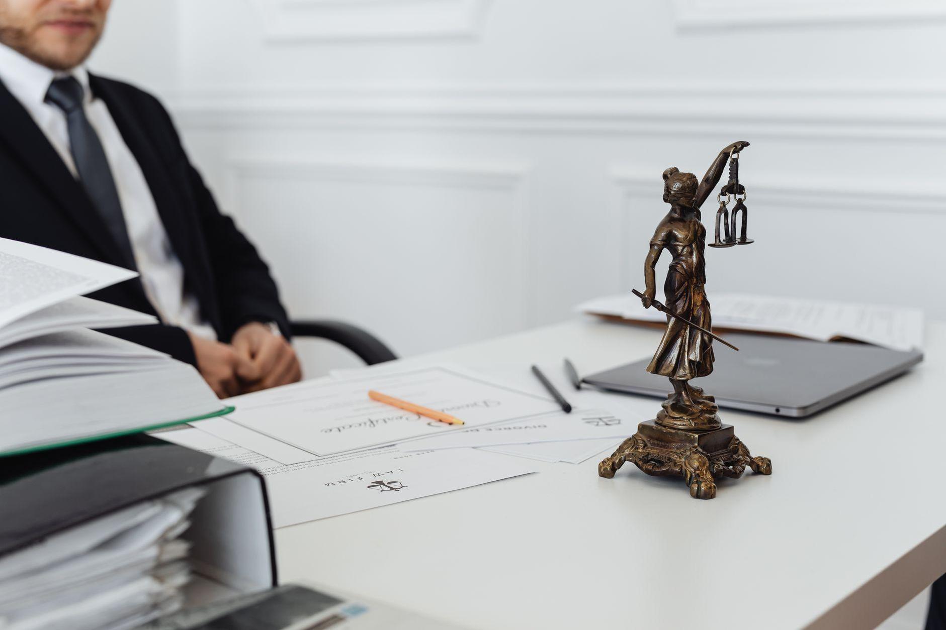 General visual reference for Landmark Legislation and Policy Contributions. Source: Pexels / Photo by www.kaboompics.com / Pexels License / https://www.pexels.com/photo/a-lawyer-behind-his-desk-7876093/