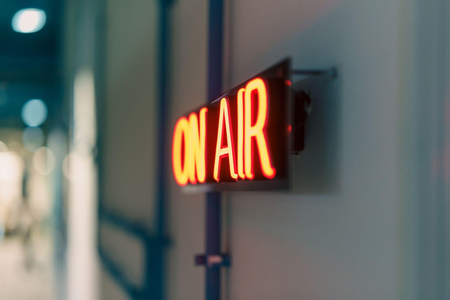 General visual reference for Transition to Twitch and Explosive Growth. Source: Pexels / Photo by Jakub Zerdzicki / Pexels License / https://www.pexels.com/photo/illuminated-neon-on-air-sign-in-studio-34368004/