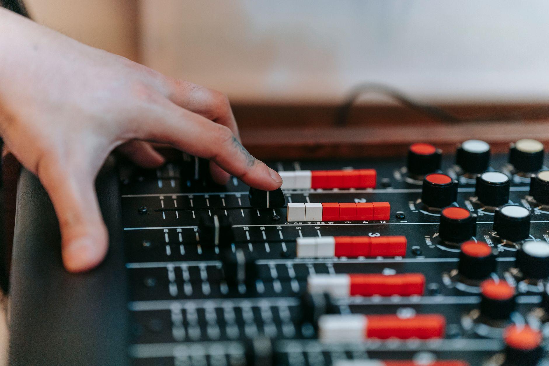 General visual reference for Addressing Criticism and Personal Evolution. Source: Pexels / Photo by Anna Pou / Pexels License / https://www.pexels.com/photo/hand-using-sound-mixing-console-8132717/