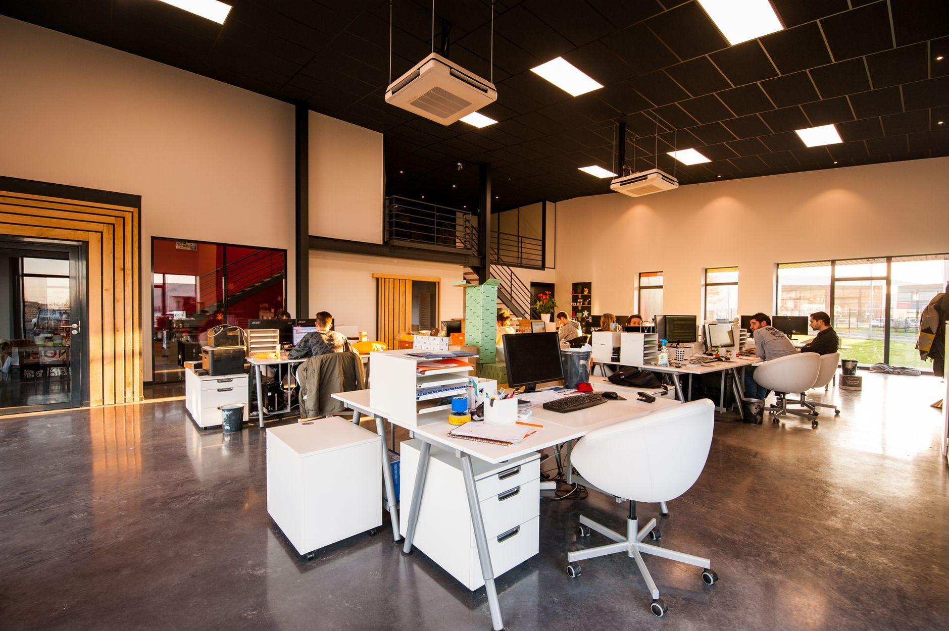 General visual reference for The Muze Entertainment's Strategic Vision. Source: Pexels / Photo by CadoMaestro / Pexels License / https://www.pexels.com/photo/people-sitting-on-chairs-beside-their-desks-in-an-office-1170412/