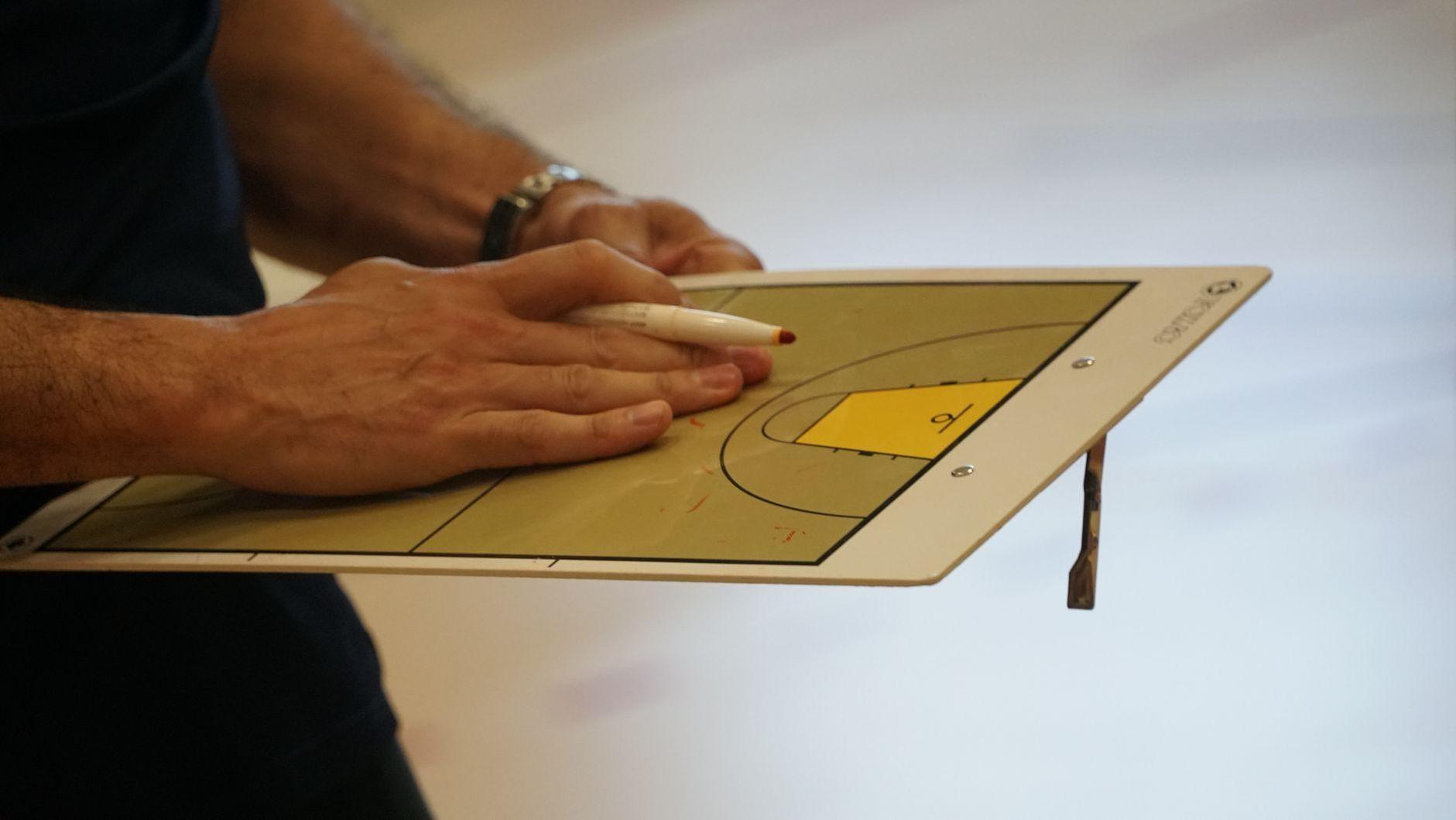 General visual reference for Stepping into Coaching: Early Assistant Roles. Source: Pexels / Photo by Coen Crevels / Pexels License / https://www.pexels.com/photo/basketball-coach-strategizing-on-tactics-board-32688082/