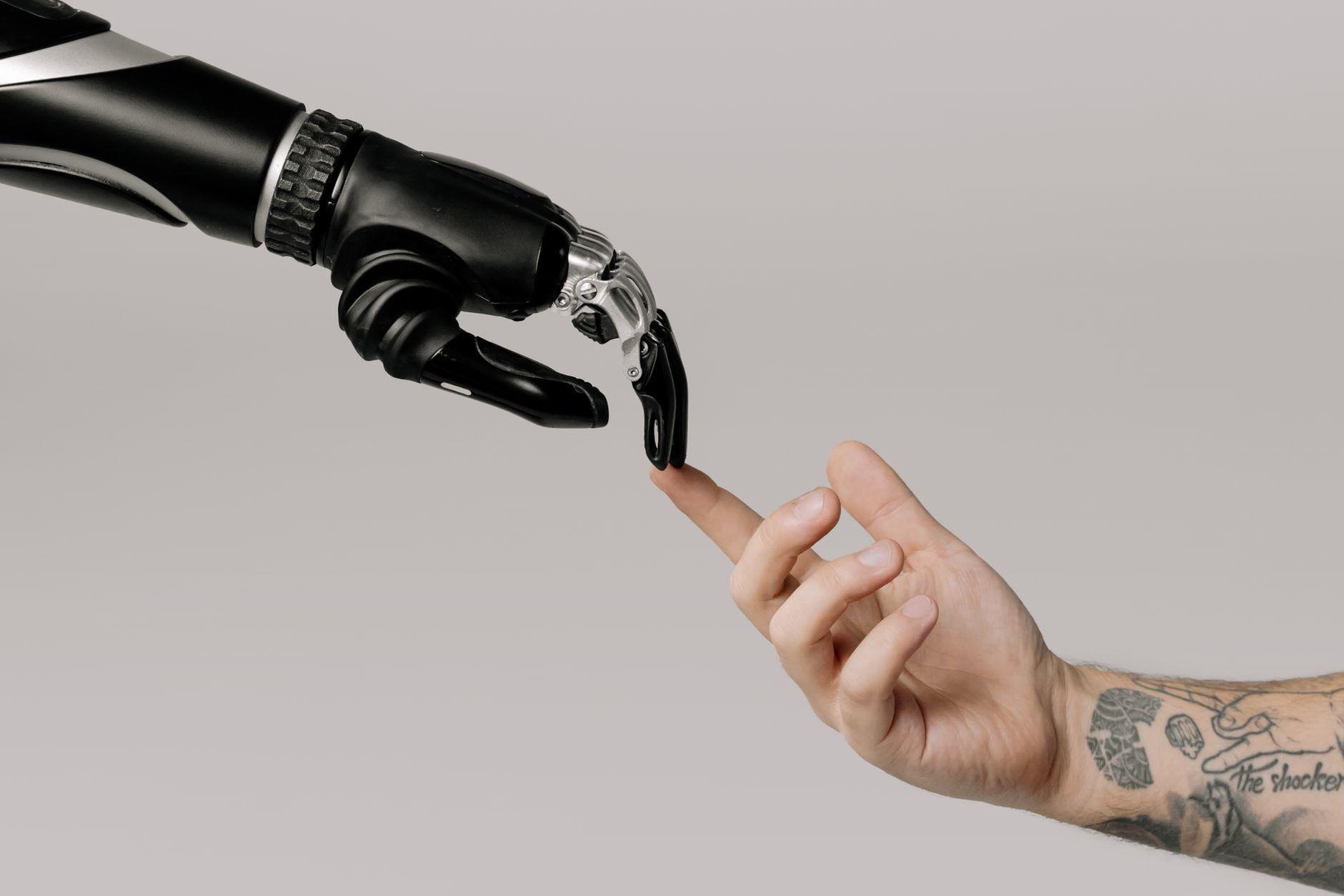 General visual reference for Thematic Analysis: The Cost of Ultimate Power. Source: Pexels / Photo by cottonbro studio / Pexels License / https://www.pexels.com/photo/bionic-hand-and-human-hand-finger-pointing-6153354/