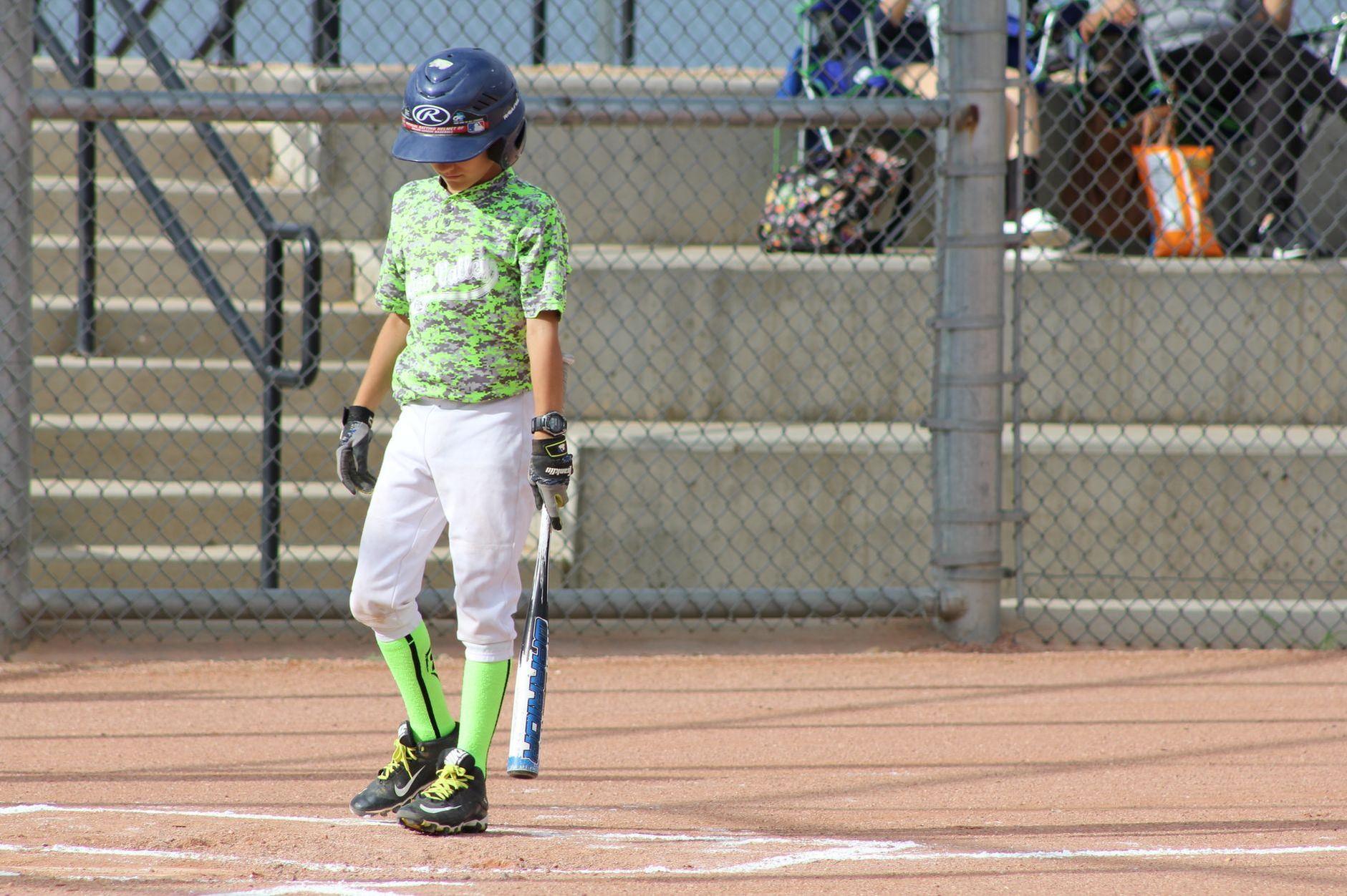 General visual reference for Early Life and Amateur Foundation. Source: Pexels / Photo by Michelle Price Miller / Pexels License / https://www.pexels.com/photo/boy-in-green-t-shirt-and-white-pants-holding-a-baseball-bat-5203104/