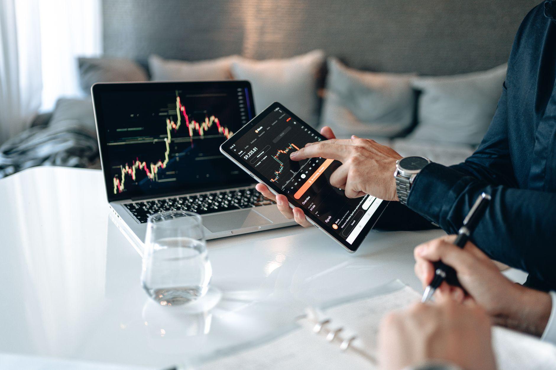 General visual reference for The Cardinals' Development Track Record. Source: Pexels / Photo by AlphaTradeZone / Pexels License / https://www.pexels.com/photo/hands-of-a-person-holding-a-digital-tablet-near-a-computer-laptop-5833255/