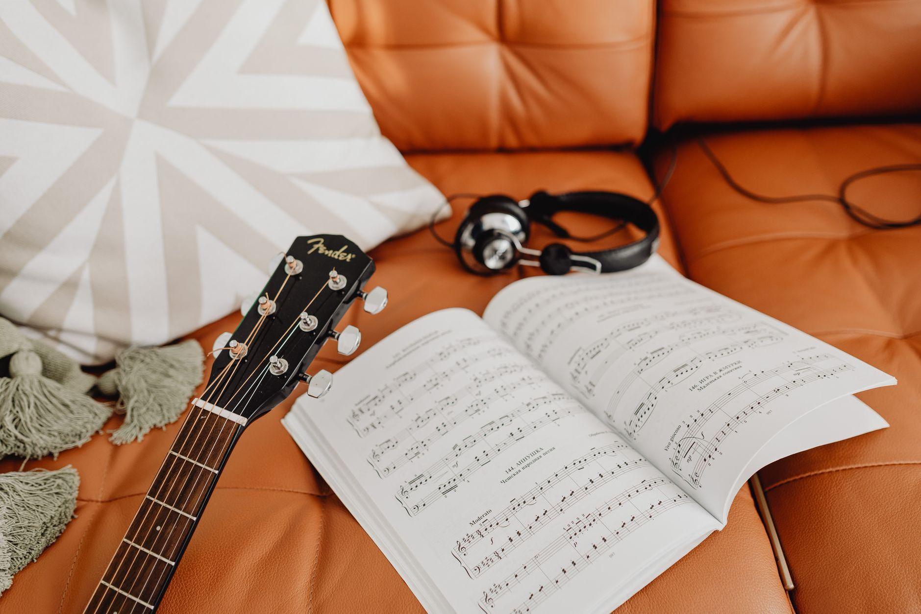 General visual reference for Vocal Artistry and Songwriting Themes. Source: Pexels / Photo by www.kaboompics.com / Pexels License / https://www.pexels.com/photo/music-notes-on-sofa-5902812/