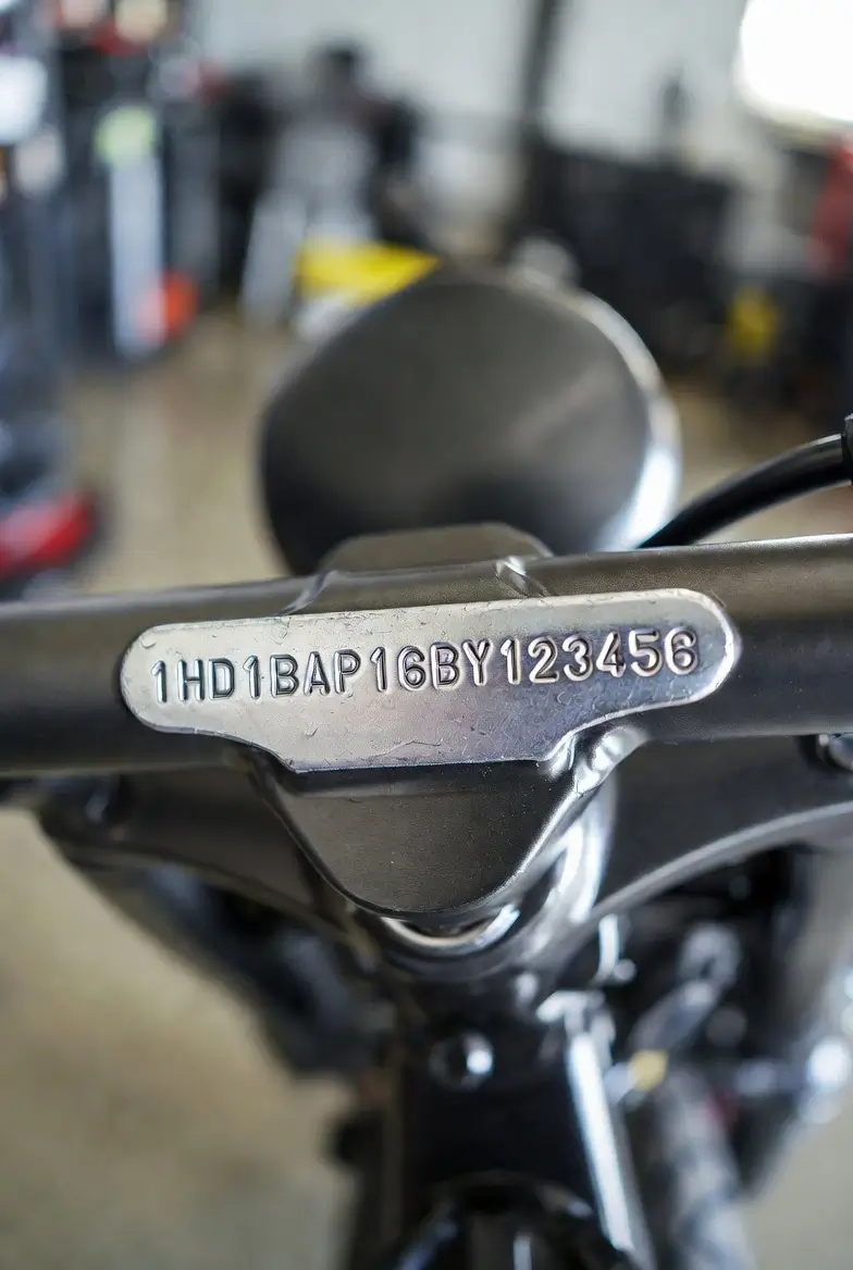 Harley-Davidson motorcycle VIN plate on frame near steering head