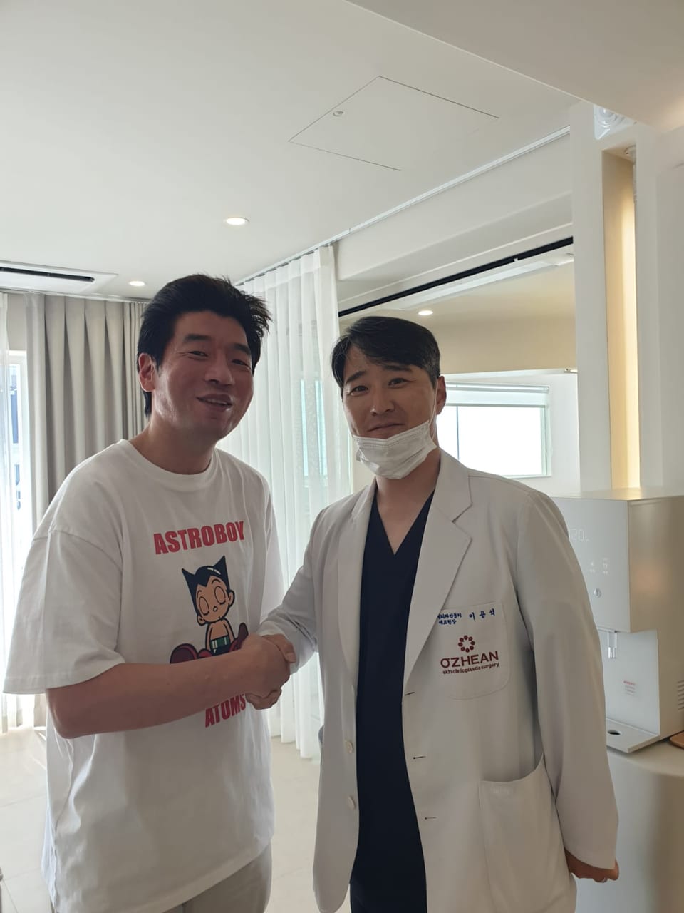 Steven shaking hands with his doctor at the clinic in Korea