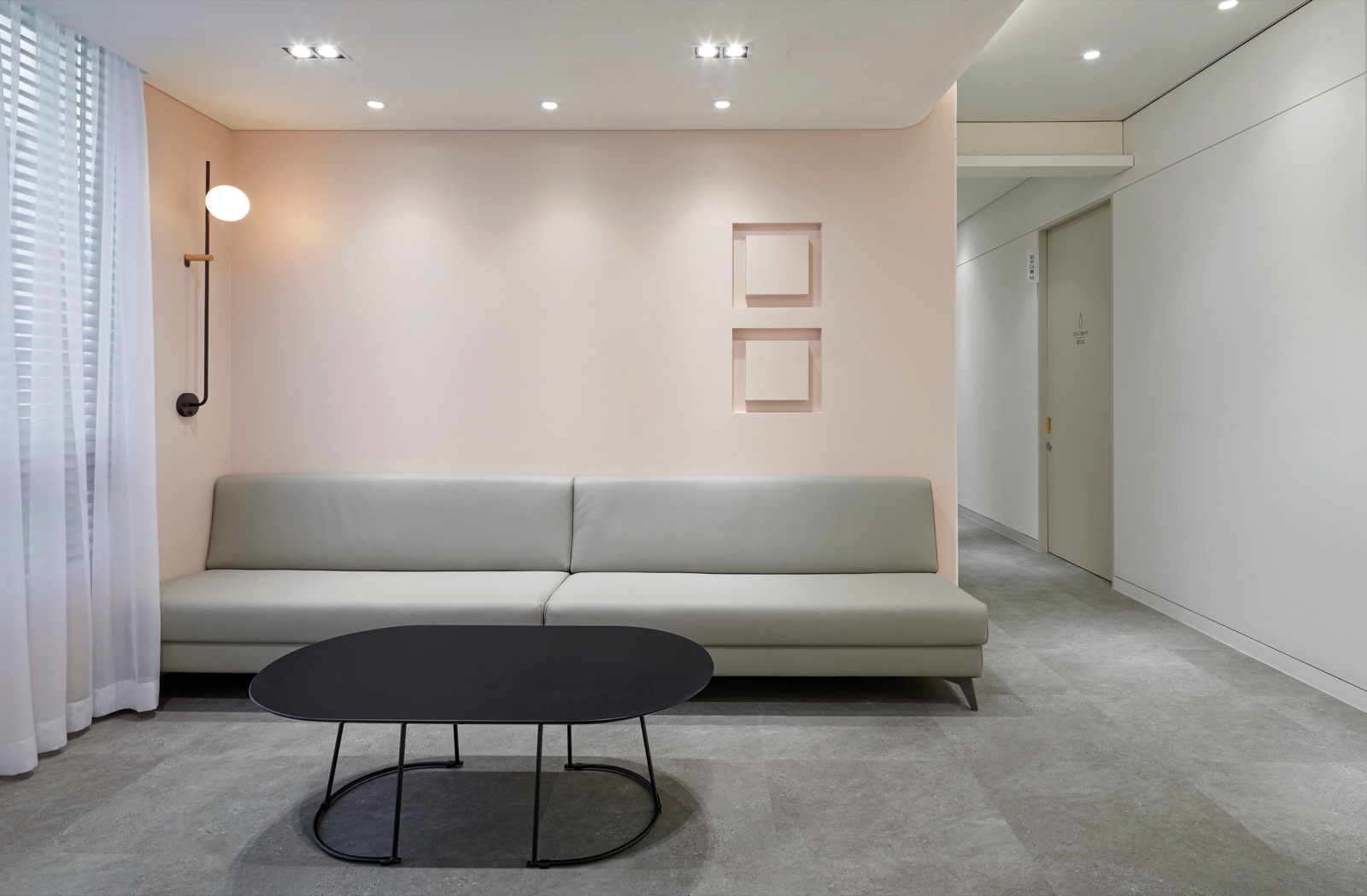 Inner waiting area with a sofa and a low table