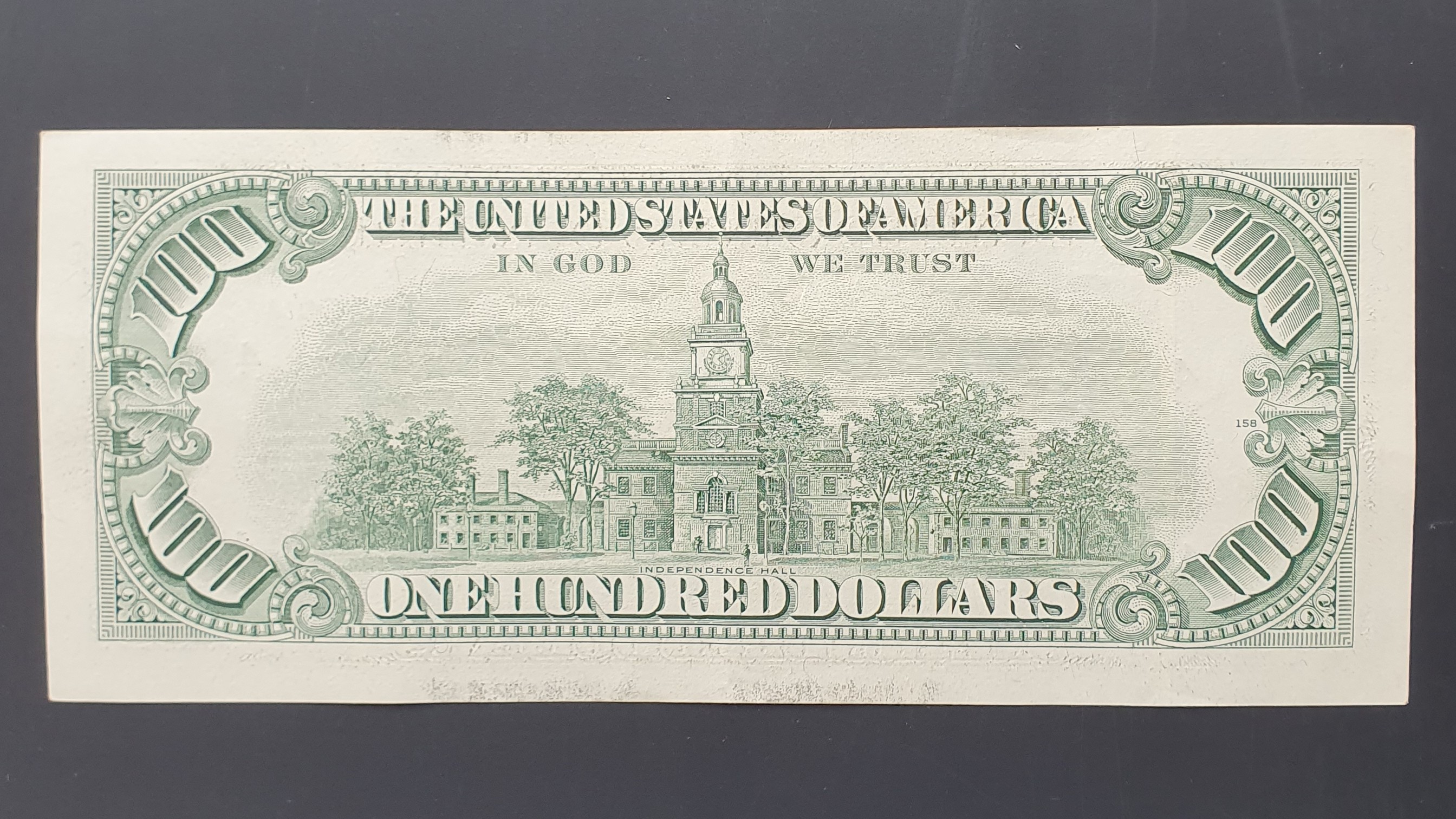 100 Dollar back