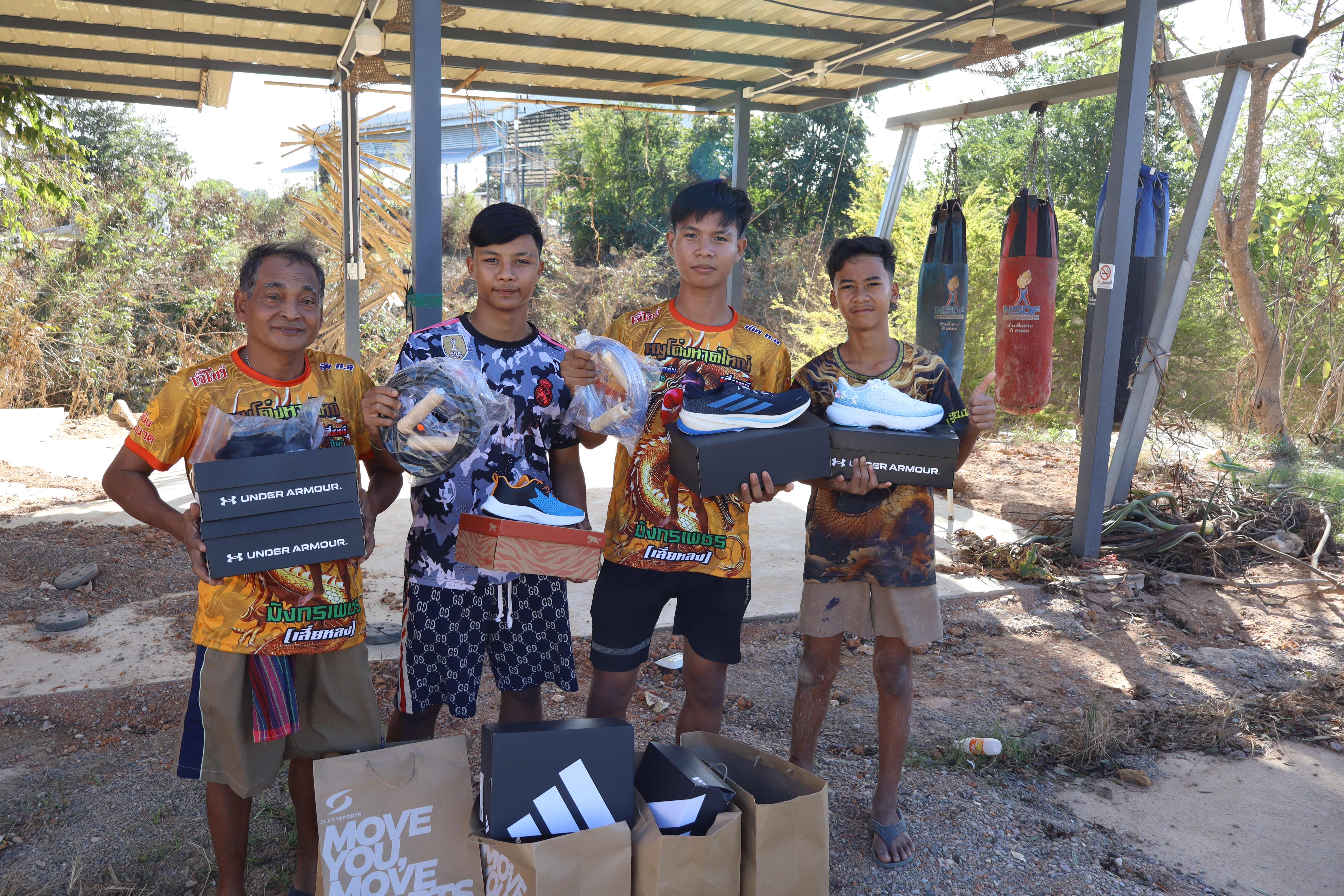 11 pairs of shoes donated to the muay thai team