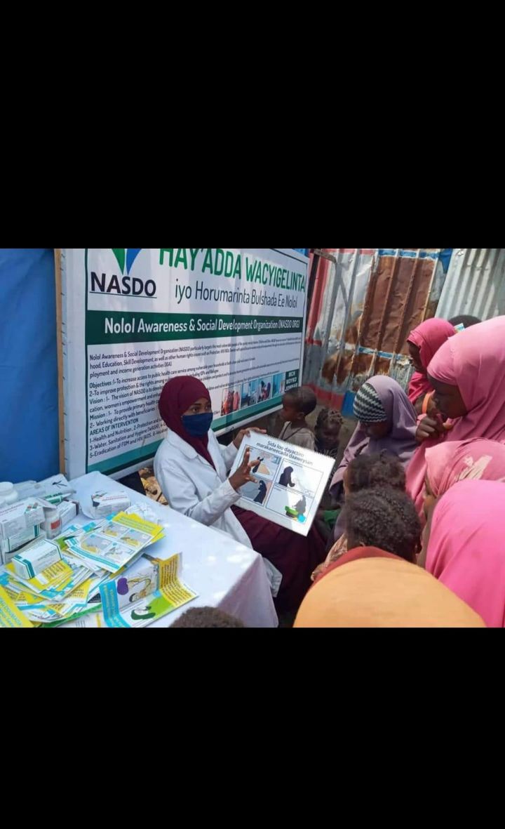 Treated mosquito nets and child checks in Baarey Village