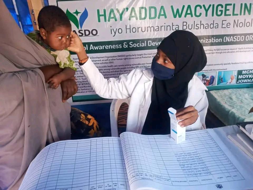 A NASDO nurse checks a child’s blood level at an MCH