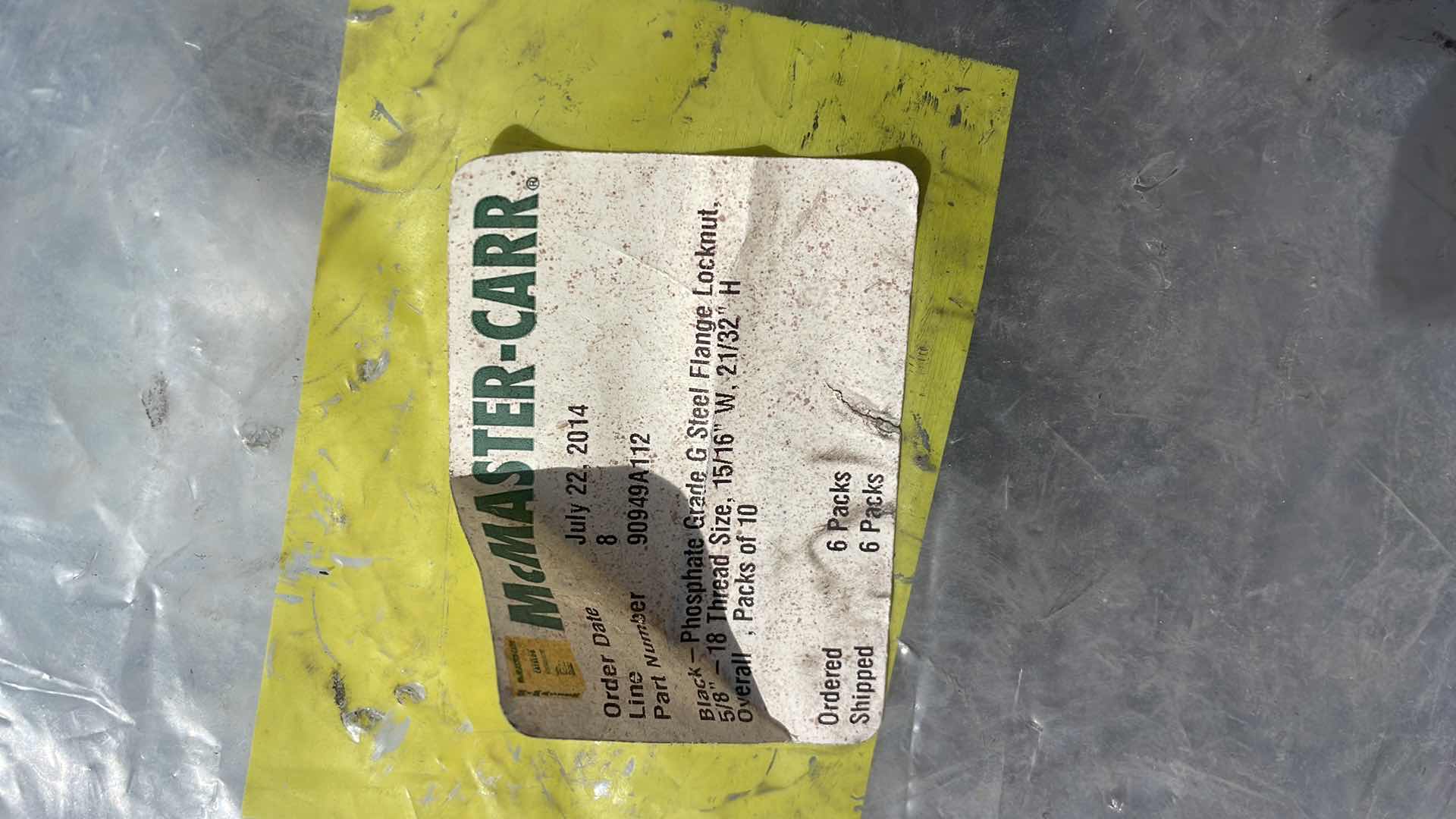 Photo 1 of BLACK - PHOSPHATE GRADE G STEEL FLANGE LOCKNUT 5/8"- 18 THREAD SIZE, 15/16" W, 21/32" H OVERALL, 6 PACKS OF 10