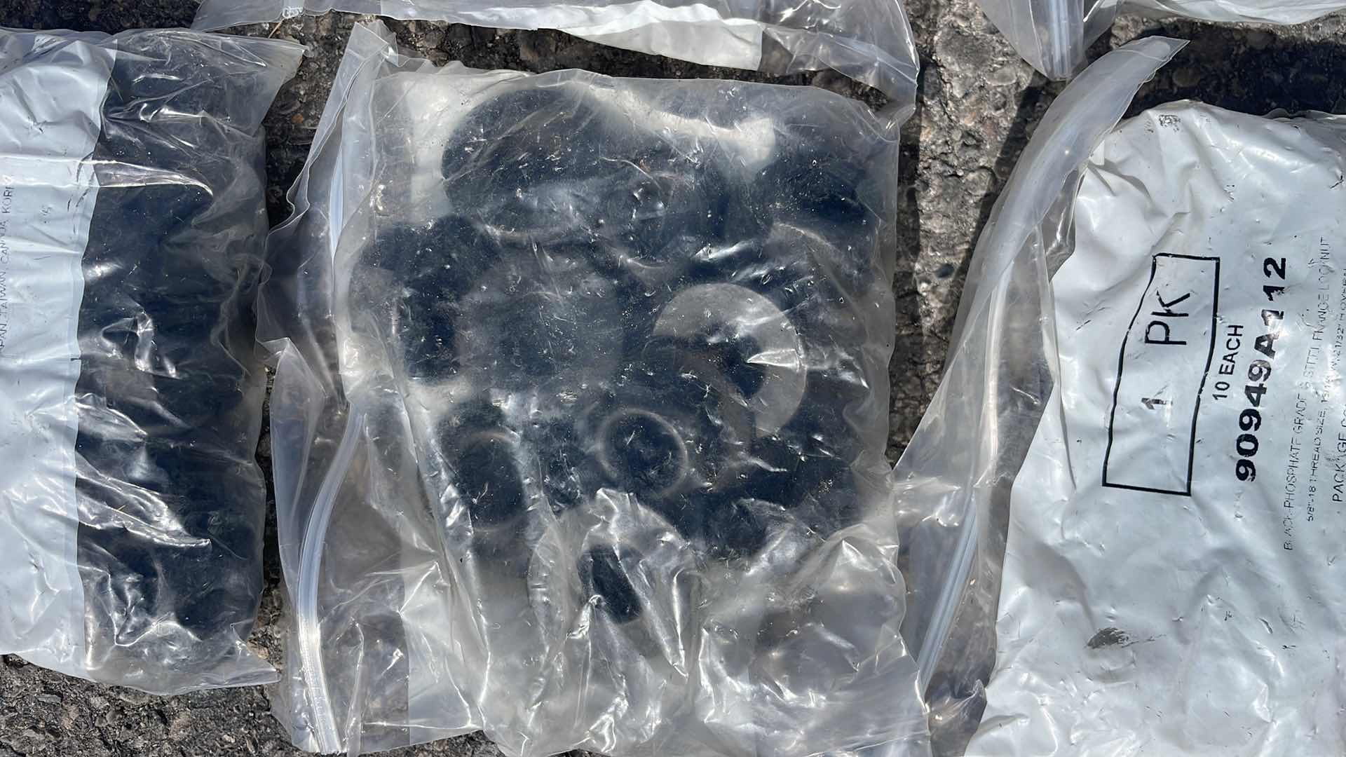 Photo 1 of BLACK - PHOSPHATE GRADE G STEEL FLANGE LOCKNUT 5/8"- 18 THREAD SIZE, 15/16" W, 21/32" H OVERALL, 6 PACKS OF 10