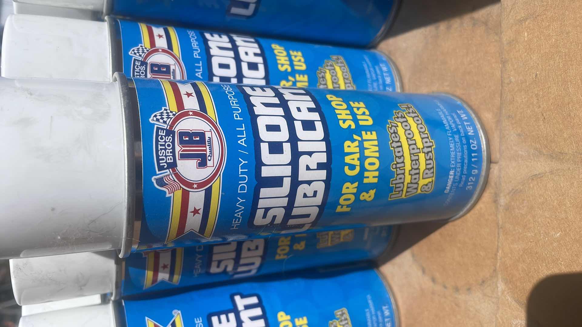 Photo 1 of JUSTICE BROS SILICONE LUBRICANT 13 CANS