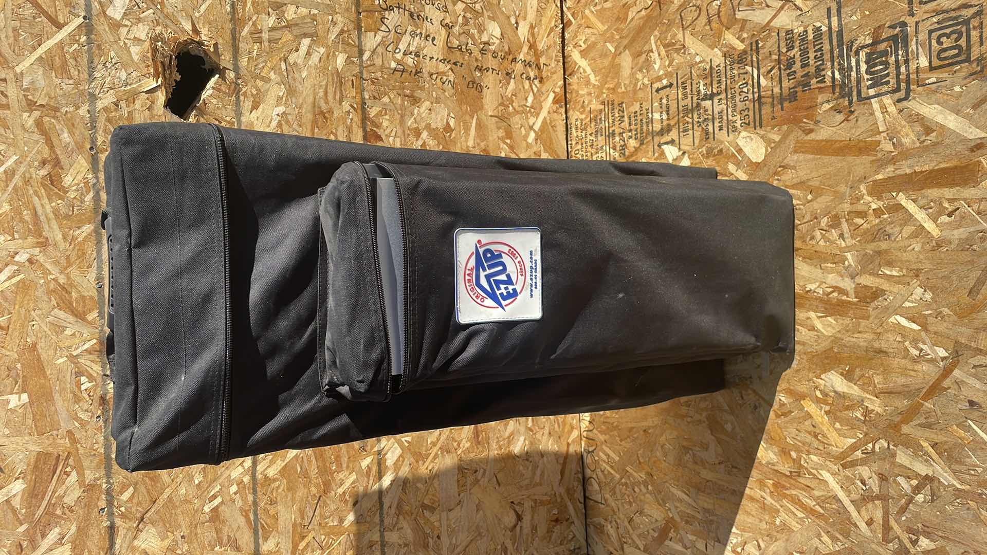 Photo 1 of E-Z UP INSTANT TABLE - 2'X4' IN ROLLER BAG