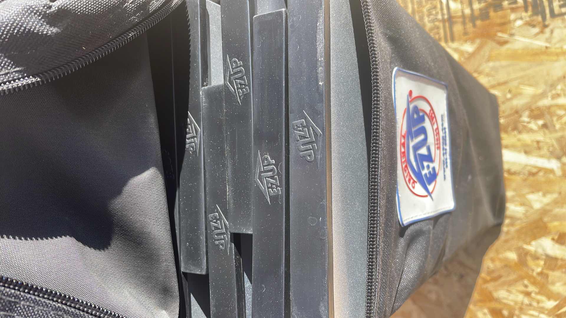 Photo 1 of E-Z UP INSTANT TABLE - 2'X4' IN ROLLER BAG