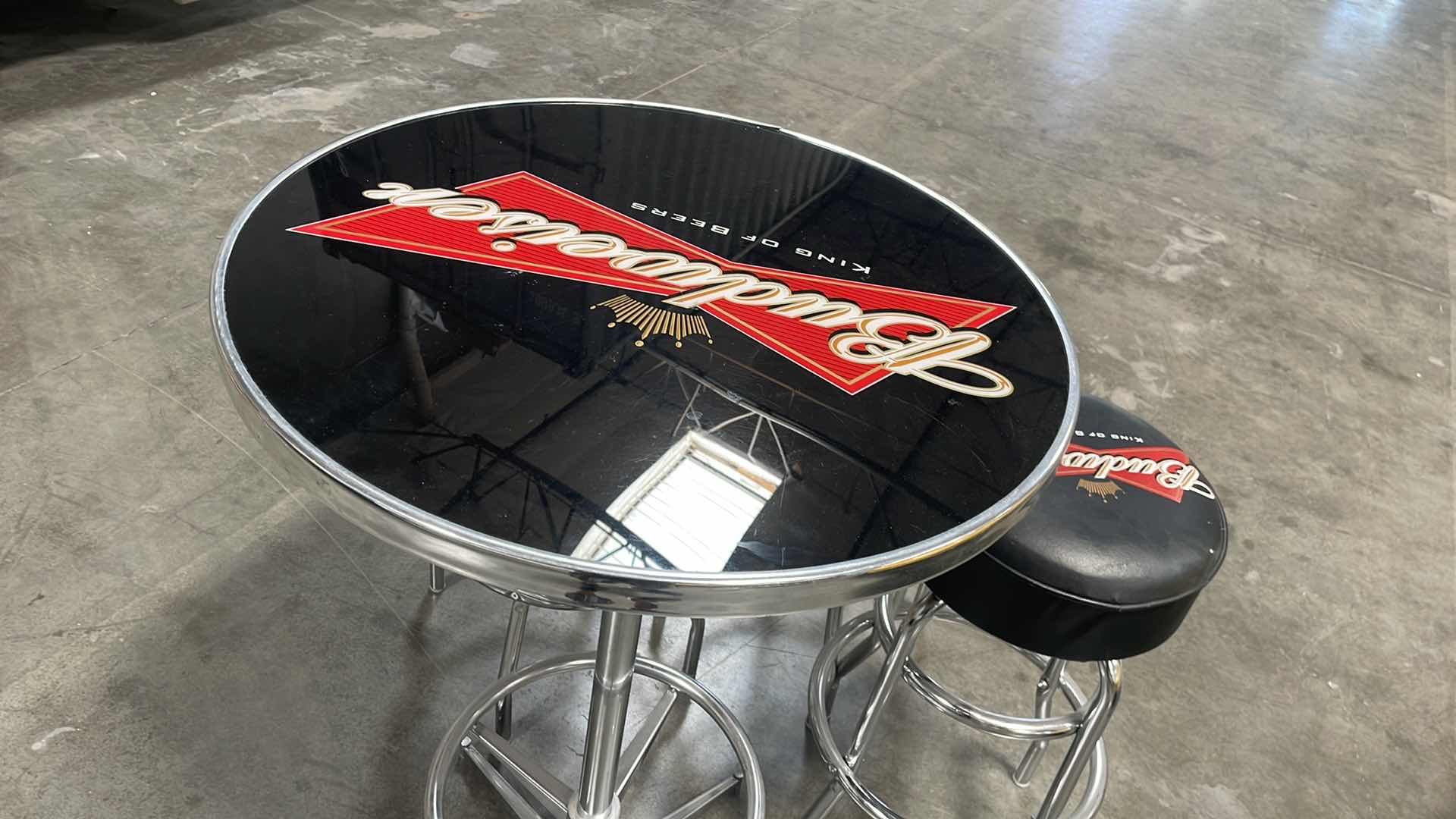 Photo 1 of BUDWEISER BAR TABLE 27” AND 3 BAR STOOLS