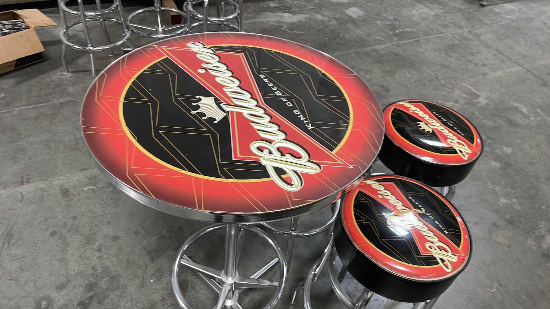 Photo 1 of BUDWEISER BAR TABLE 27” AND 3 BAR STOOLS