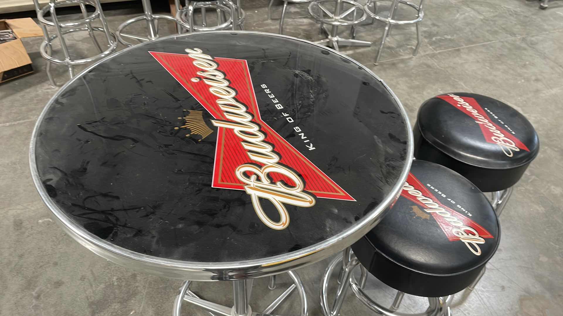 Photo 1 of BUDWEISER BAR TABLE 27” AND 3 BAR STOOLS