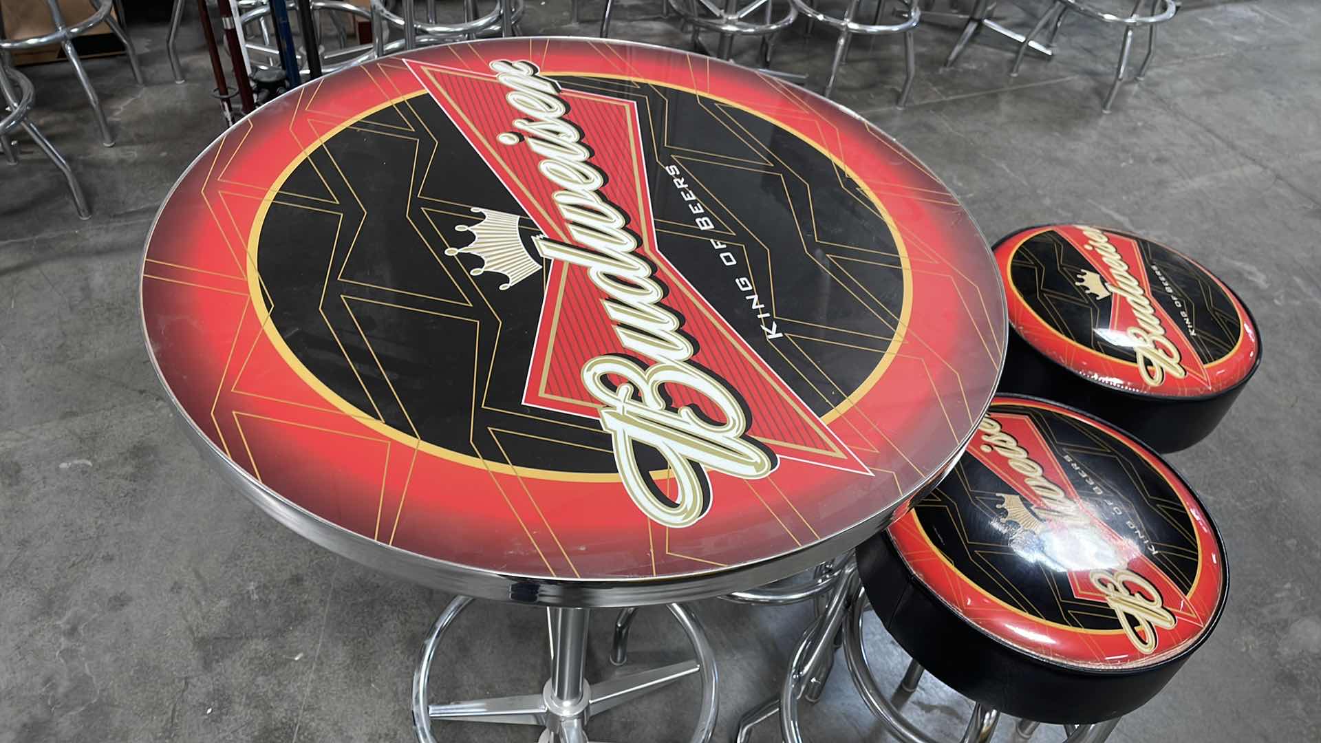 Photo 1 of BUDWEISER BAR TABLE 27” AND 3 BAR STOOLS
