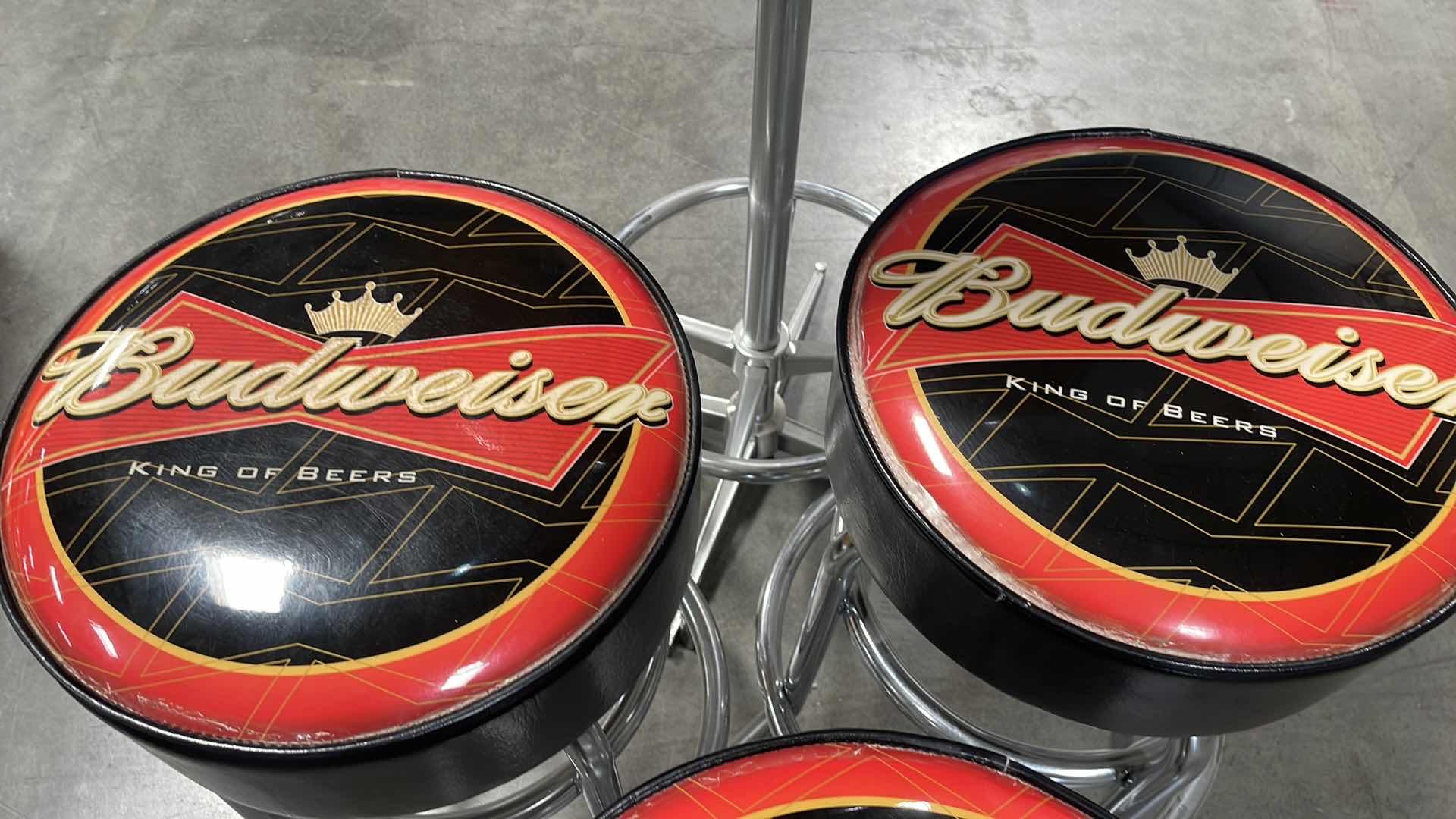 Photo 1 of BUDWEISER BAR TABLE 27” AND 3 BAR STOOLS