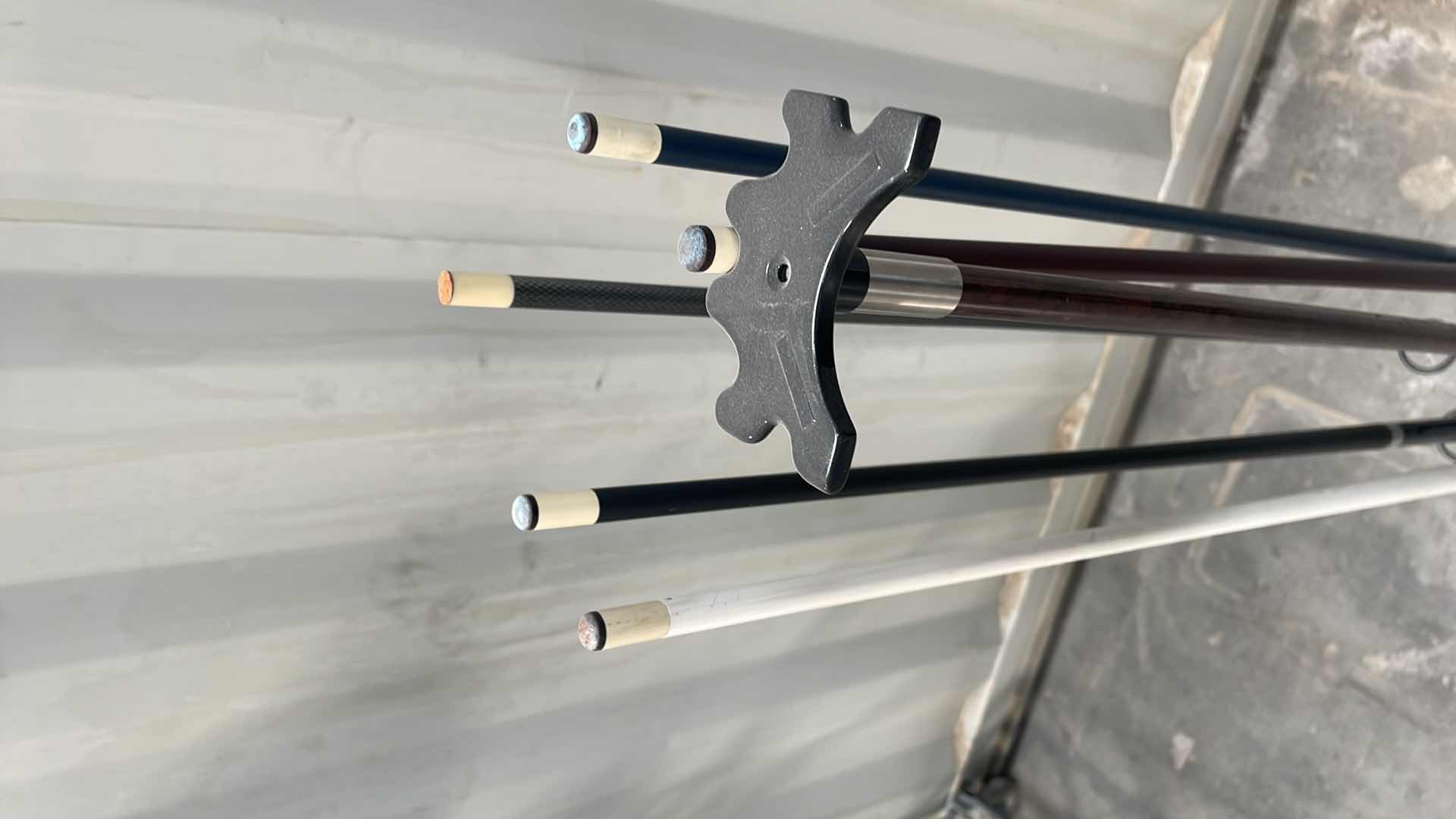 Photo 1 of BILLARD STICKS AND STAND ONE PIECE POOL CUES