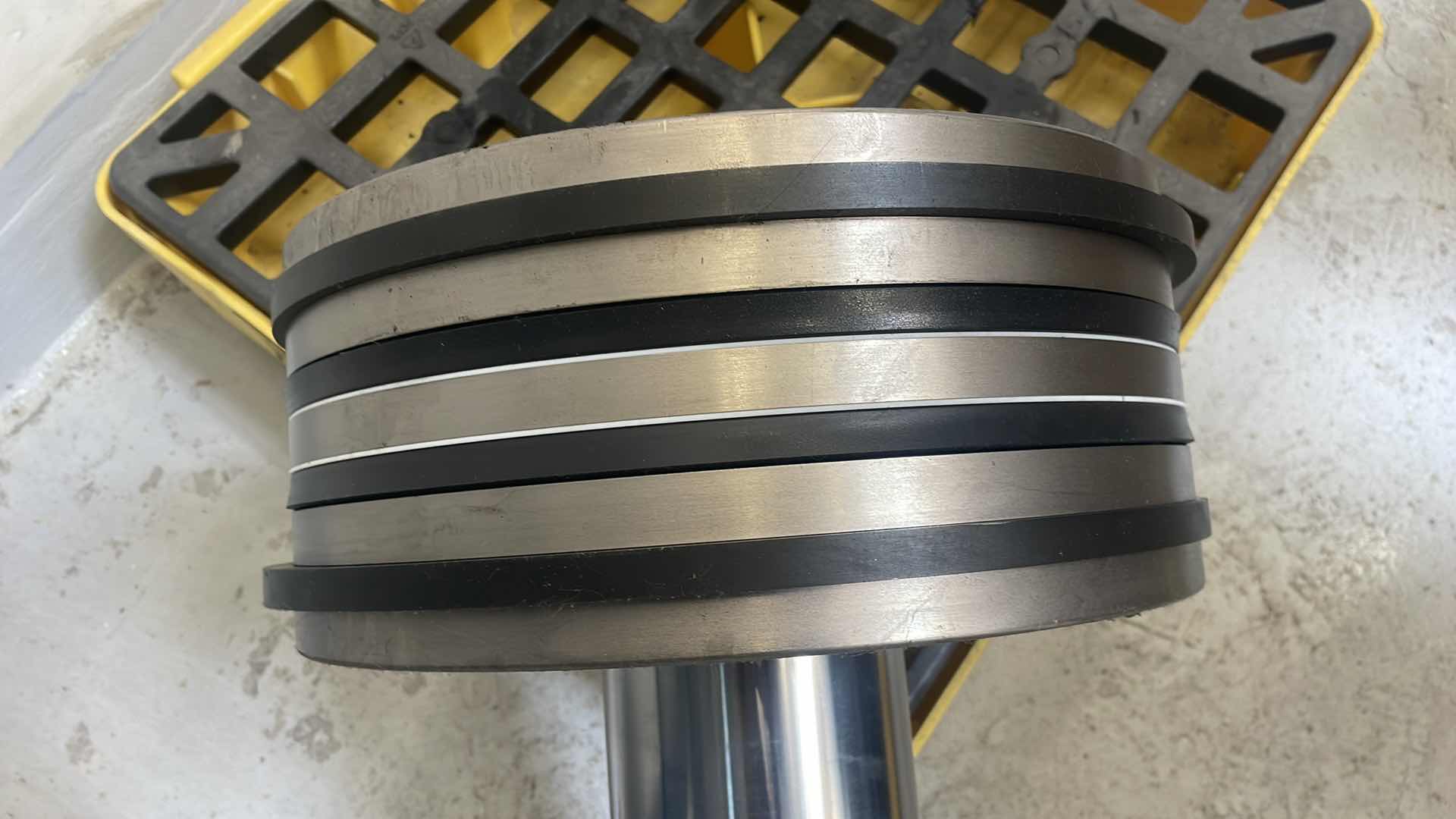 Photo 1 of CHUNK OF STAINLESS STEEL EXTREMELY HEAVY TOP IS 5” DIAMETER X 36-1/2” BASE IS ABOUT 14” DIAMETER X 6”