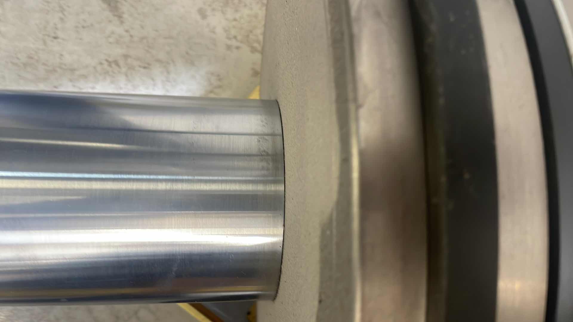 Photo 1 of CHUNK OF STAINLESS STEEL EXTREMELY HEAVY TOP IS 5” DIAMETER X 36-1/2” BASE IS ABOUT 14” DIAMETER X 6”