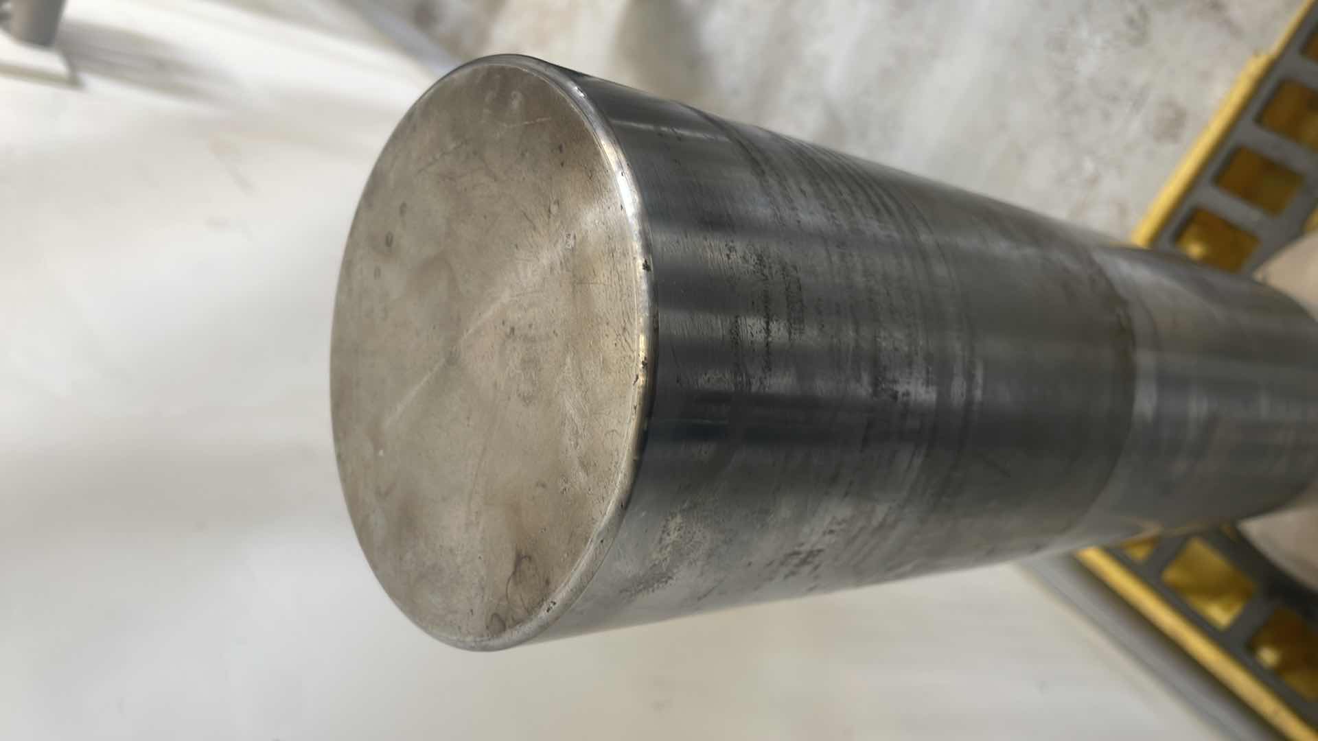 Photo 1 of CHUNK OF STAINLESS STEEL EXTREMELY HEAVY TOP IS 5” DIAMETER X 36-1/2” BASE IS ABOUT 14” DIAMETER X 6”