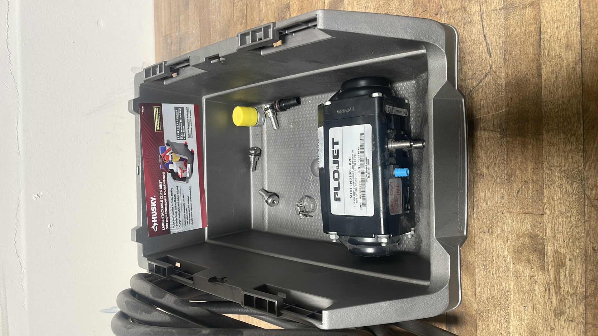 Photo 1 of FLOJET DOUBLE DIAPHRAGM PUMP: AIR, ACETAL, BOLT, 3/8 IN FLUID CONNECTION SIZE, BARBED, VITON, MODEL N5100020G WITH 1/4” HOSE &MISC. PARTS IN A HUSKY LARGE STACKABLE CLICK BIN