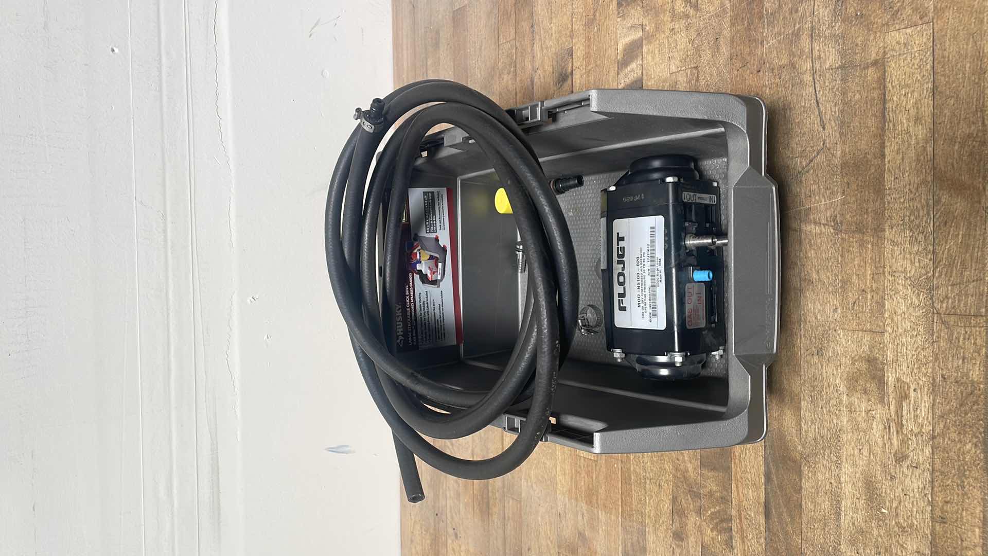 Photo 1 of FLOJET DOUBLE DIAPHRAGM PUMP: AIR, ACETAL, BOLT, 3/8 IN FLUID CONNECTION SIZE, BARBED, VITON, MODEL N5100020G WITH 1/4” HOSE &MISC. PARTS IN A HUSKY LARGE STACKABLE CLICK BIN