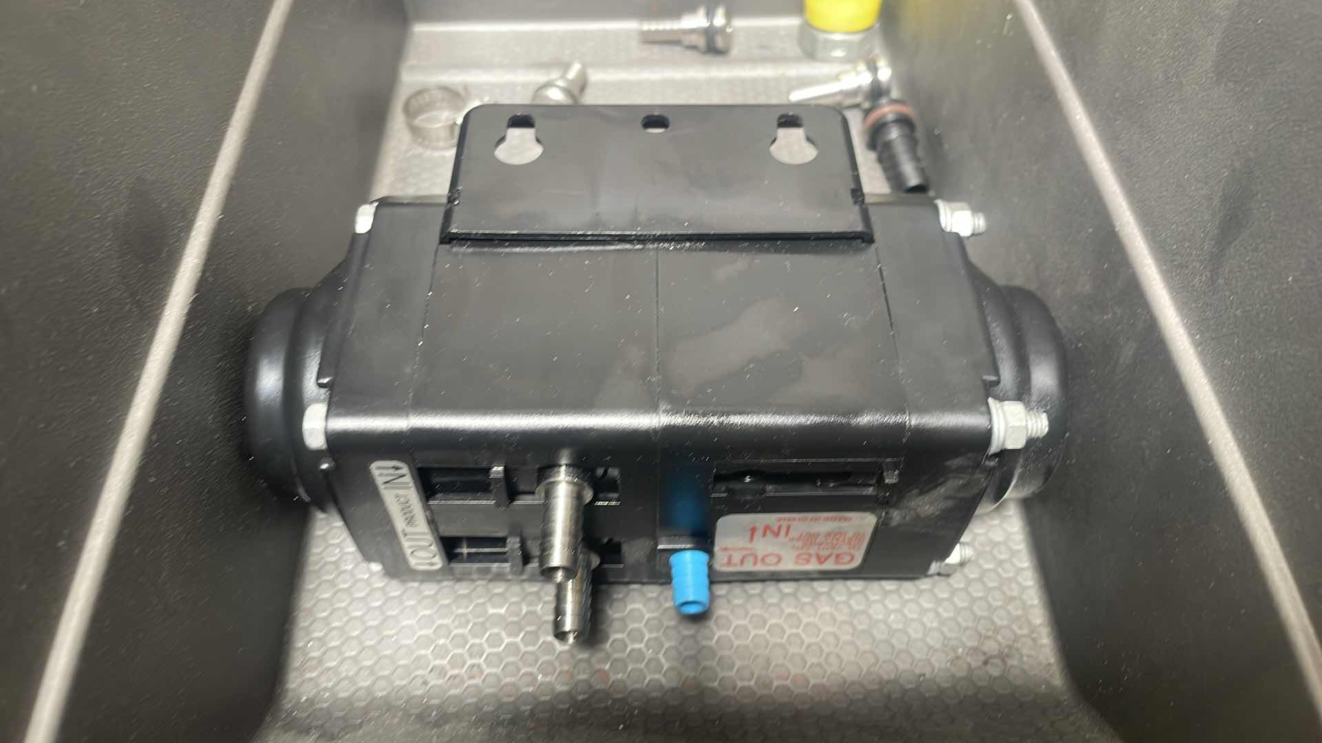 Photo 1 of FLOJET DOUBLE DIAPHRAGM PUMP: AIR, ACETAL, BOLT, 3/8 IN FLUID CONNECTION SIZE, BARBED, VITON, MODEL N5100020G WITH 1/4” HOSE &MISC. PARTS IN A HUSKY LARGE STACKABLE CLICK BIN