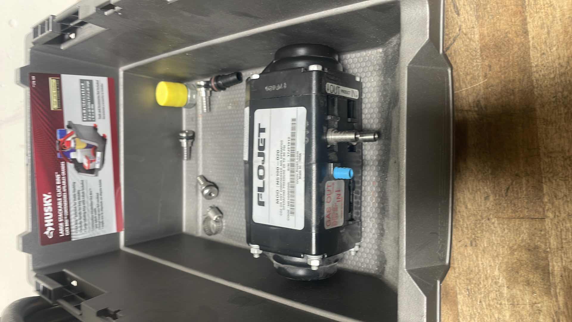 Photo 1 of FLOJET DOUBLE DIAPHRAGM PUMP: AIR, ACETAL, BOLT, 3/8 IN FLUID CONNECTION SIZE, BARBED, VITON, MODEL N5100020G WITH 1/4” HOSE &MISC. PARTS IN A HUSKY LARGE STACKABLE CLICK BIN