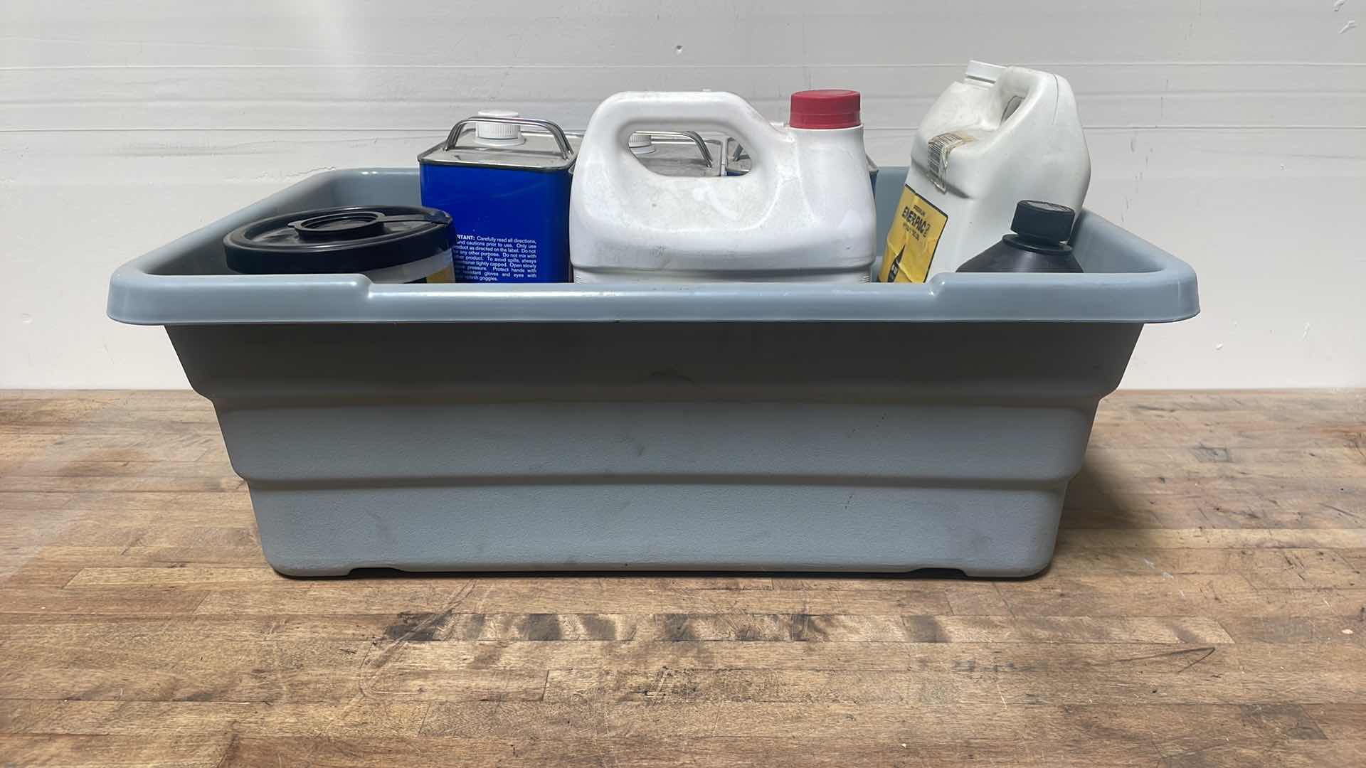 Photo 7 of MISC FLUIDS IN A GRAY PLASTIC CONTAINER SUSPENSION FLUID ABOUT 1/3 FULL