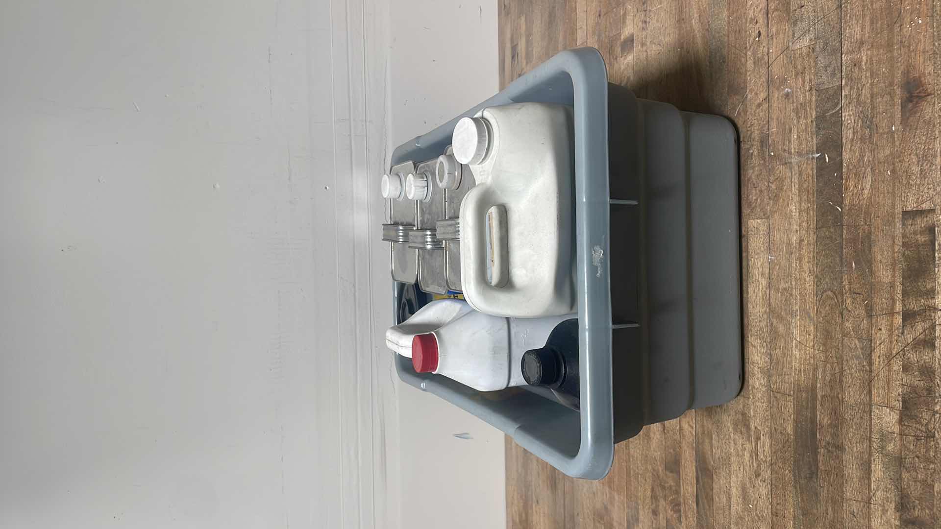 Photo 8 of MISC FLUIDS IN A GRAY PLASTIC CONTAINER SUSPENSION FLUID ABOUT 1/3 FULL