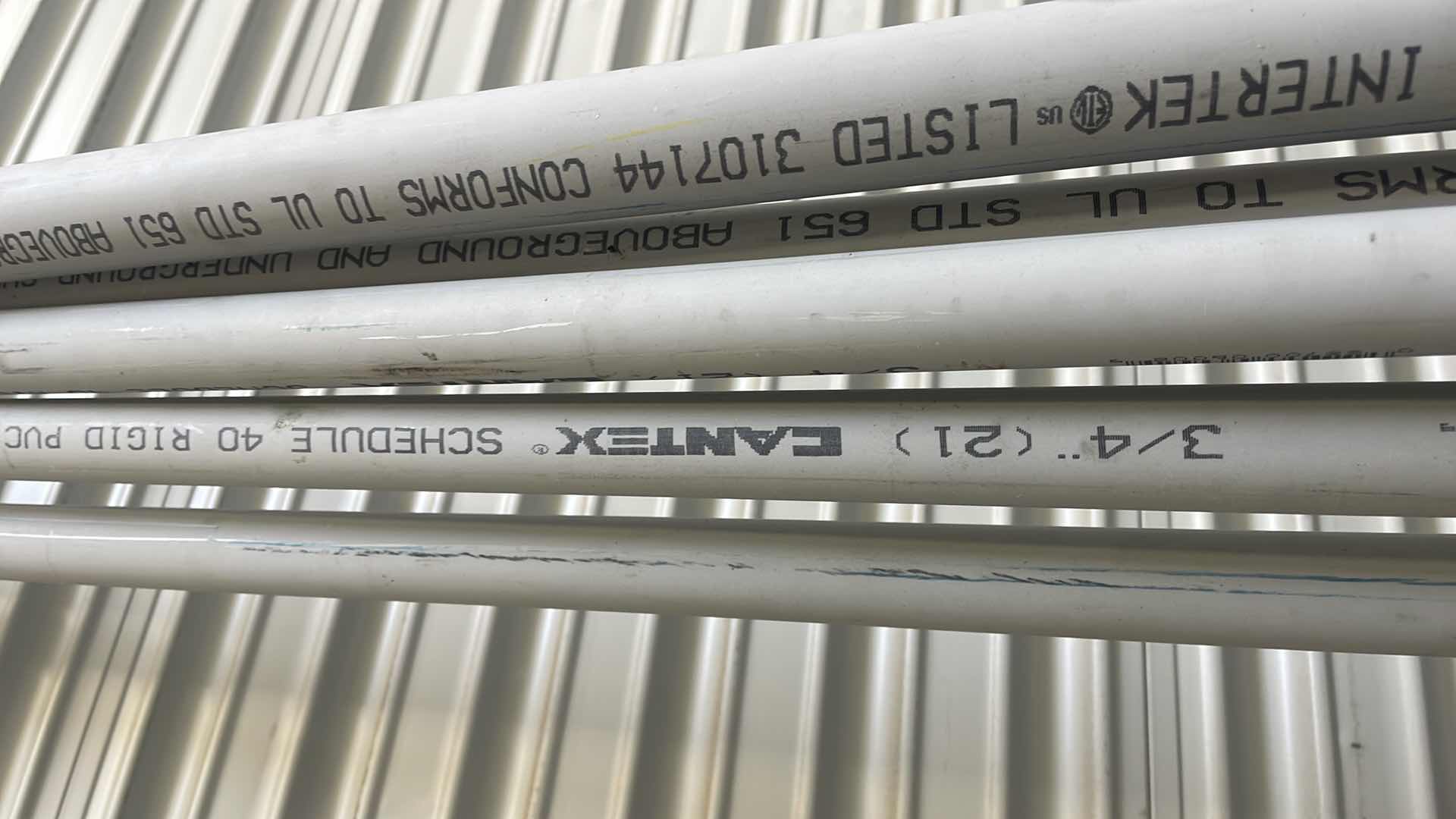 Photo 1 of ELECTRICAL CONDUIT SCHEDULE 40 3/4” 4-10’, SPARE 1” PC, 3/4 FLEX TUBING AND 15’ ROLL OF 12/3 ROMEX