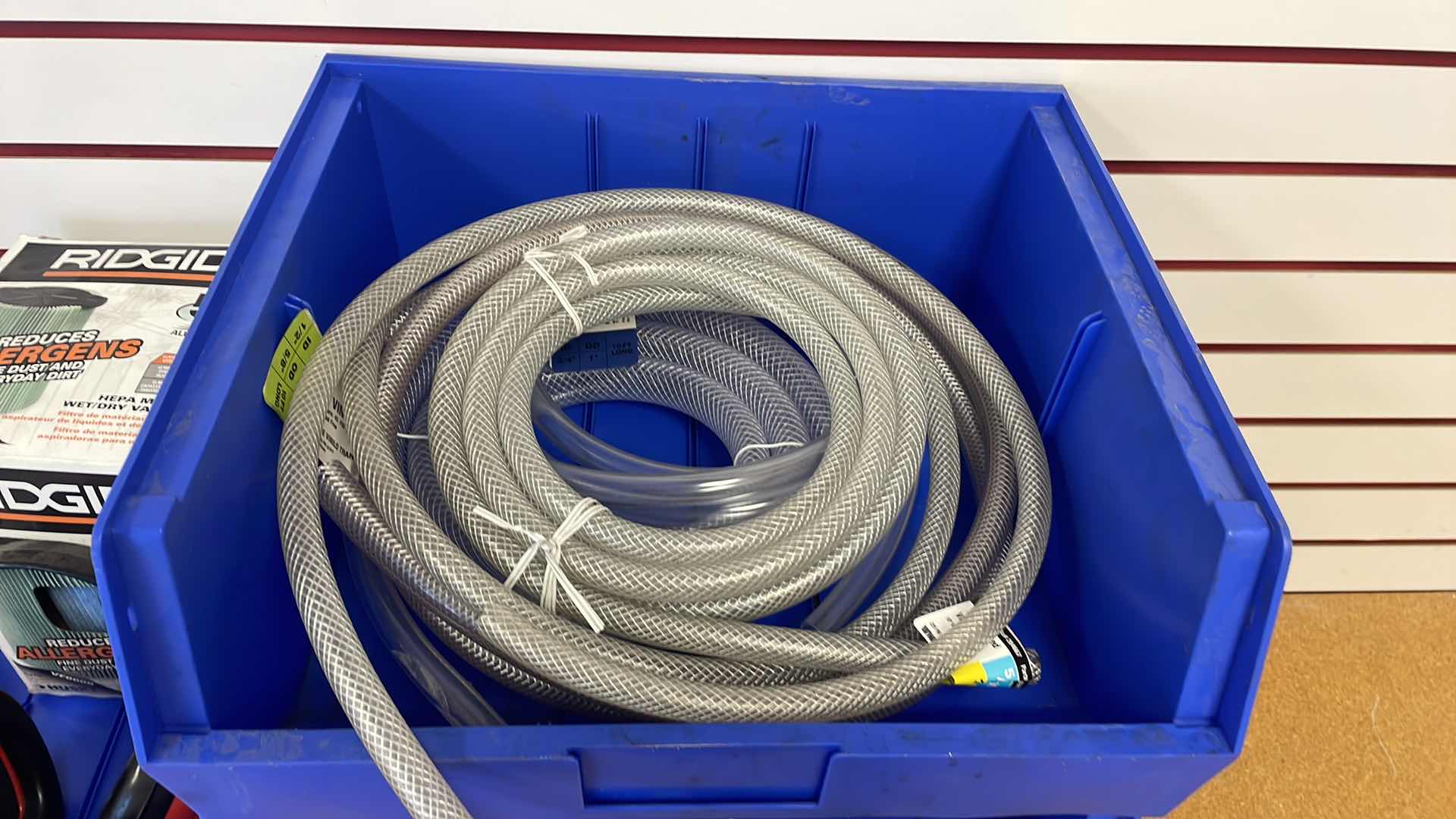 Photo 1 of DURHAM 16-1/2” x 14-1/2” x 7” STACKABLE BINS WITH ASSORTMENT OF HOSES HEARING PROTECTION AND RIDGID WET/DRY VACUUM FILTER
