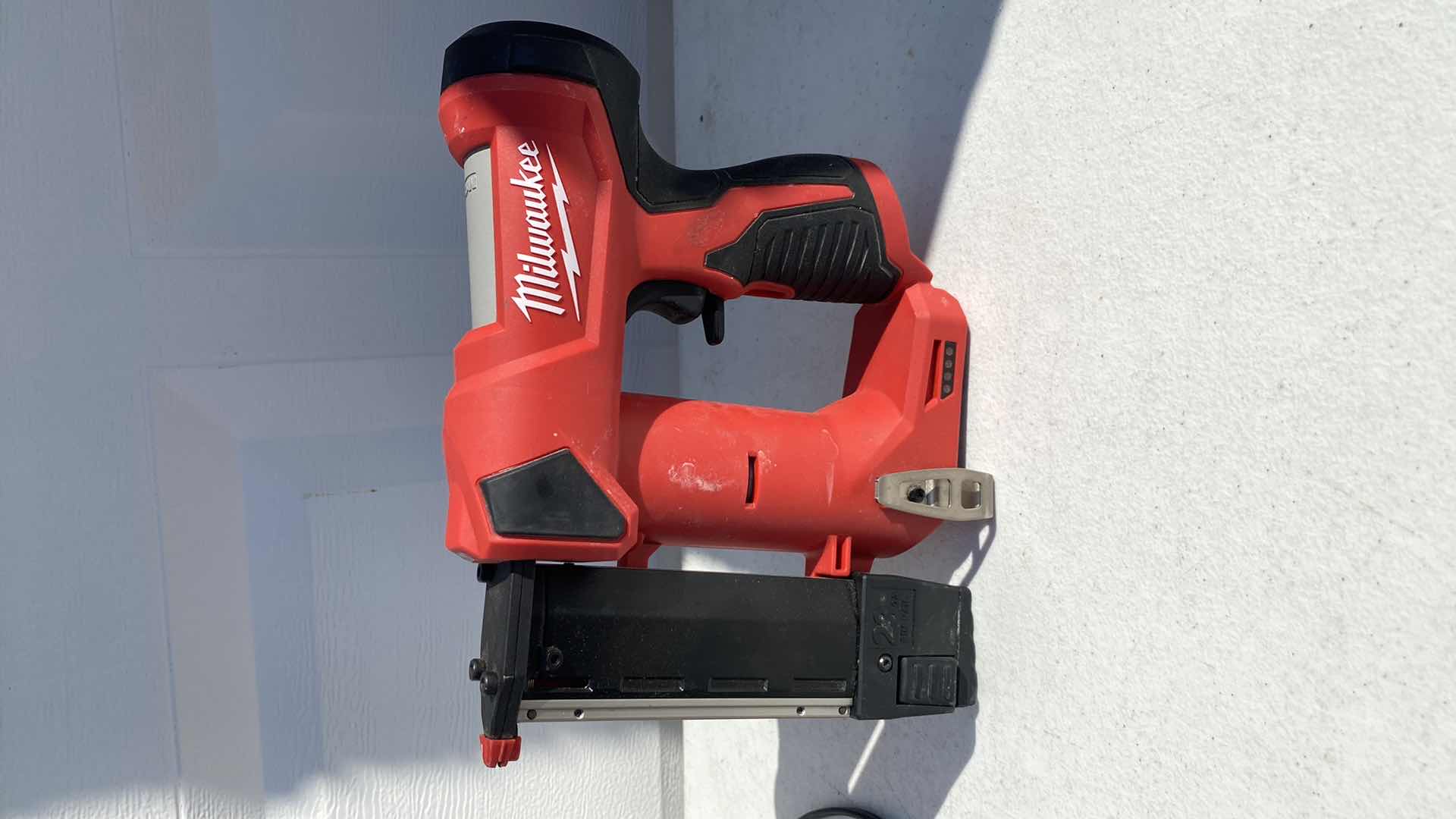 Photo 1 of MILWAULKEE 23GA PIN NAIL GUN 
BATTERY AND CHARGER INCLUDING 
TESTED WORKING