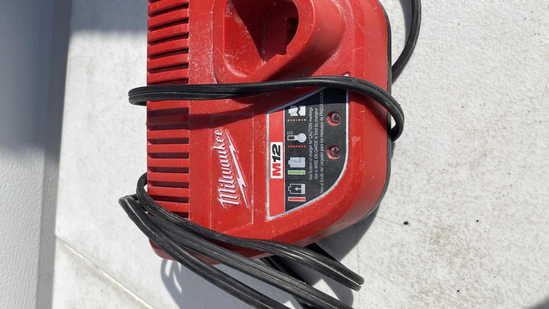 Photo 1 of MILWAULKEE 23GA PIN NAIL GUN 
BATTERY AND CHARGER INCLUDING 
TESTED WORKING