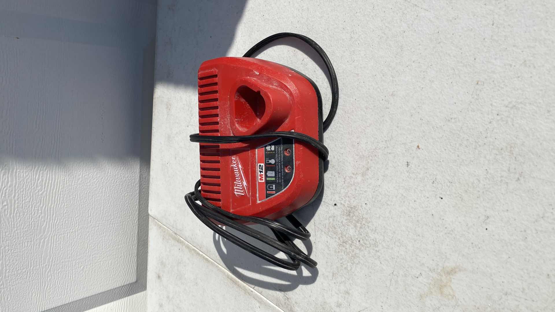 Photo 1 of MILWAULKEE 23GA PIN NAIL GUN 
BATTERY AND CHARGER INCLUDING 
TESTED WORKING