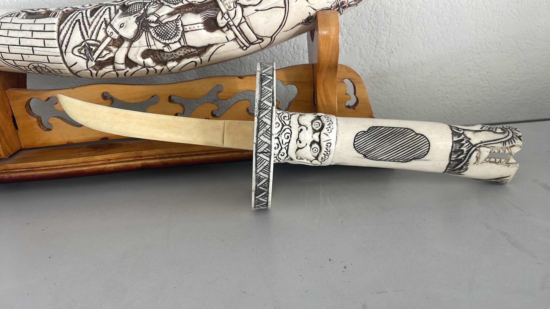Photo 1 of CARVED BONE TUSK DRAGON SWORD 28” ON WOOD STAND