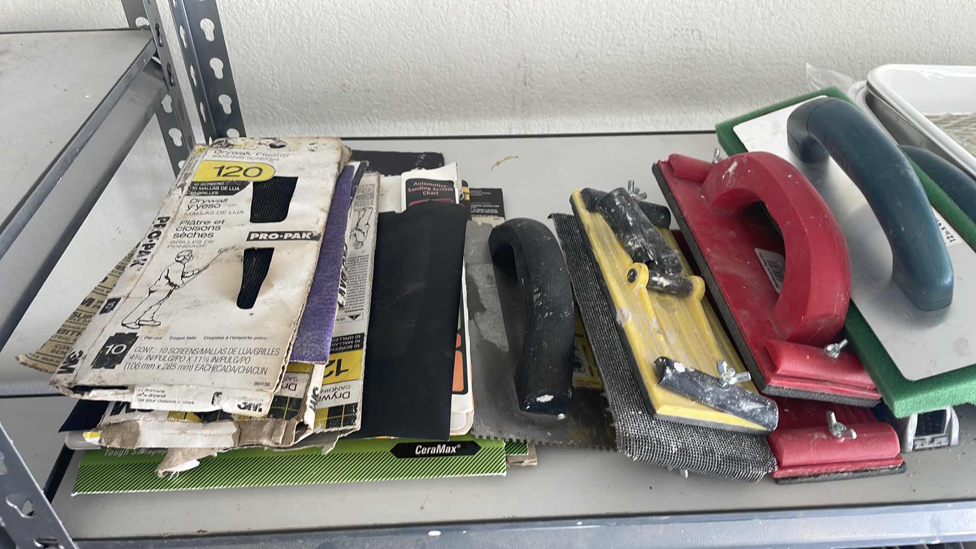 Photo 1 of CONTENTS OF SHELF, PAINT TRAYS PAINT ROLLERS SANDPAPER FOAM FLOATS