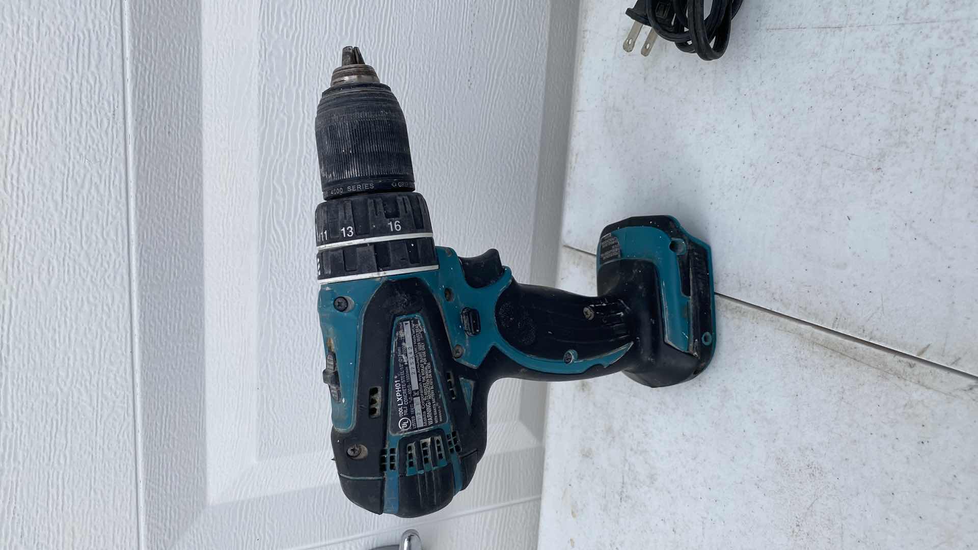 Photo 1 of MAKITA 18V IMPACT AND HAMMER DRILL AND BATTERY CHARGER NO BATTERY 
TESTED WORKING