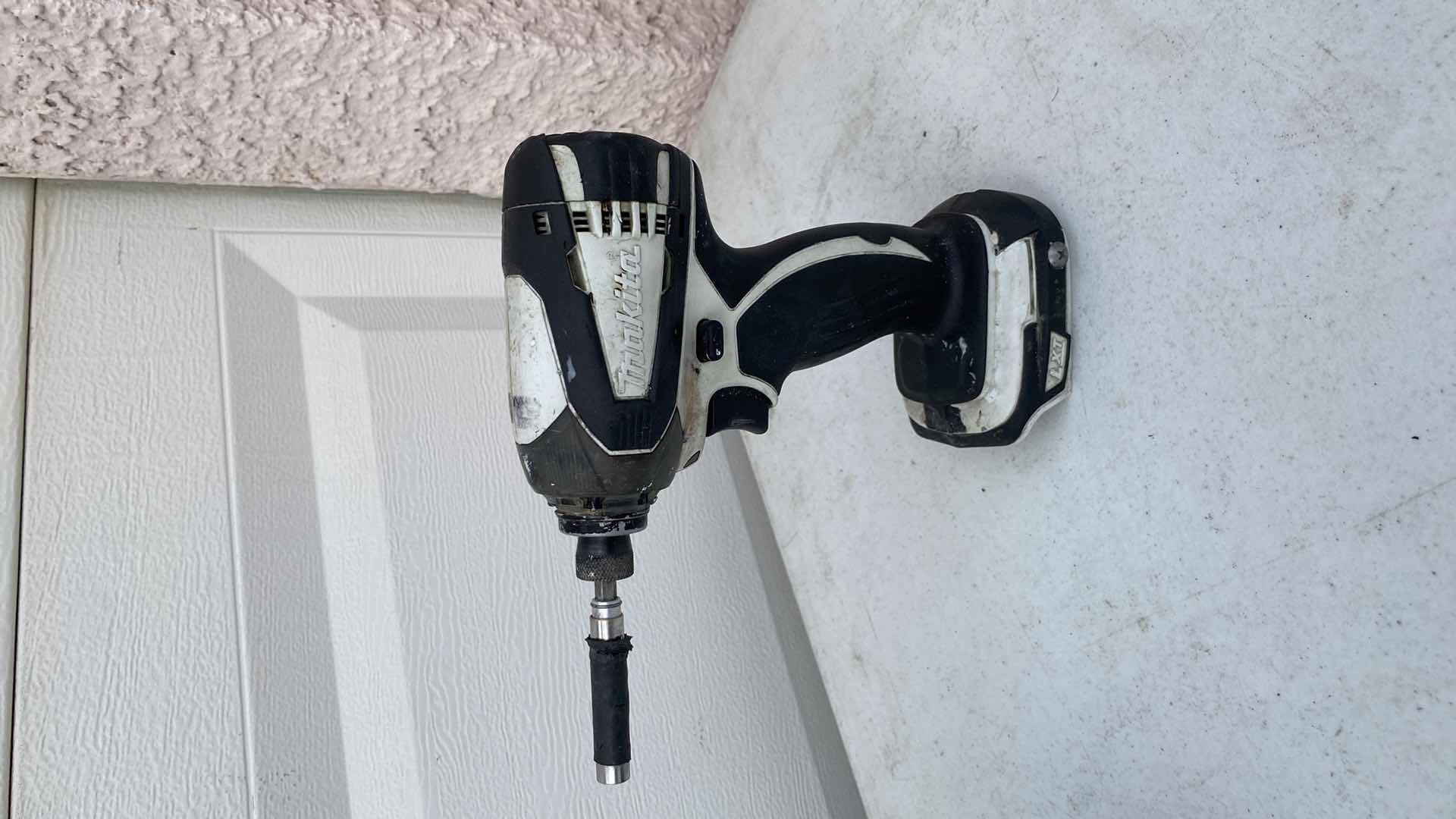 Photo 1 of MAKITA 18V IMPACT AND HAMMER DRILL AND BATTERY CHARGER NO BATTERY 
TESTED WORKING