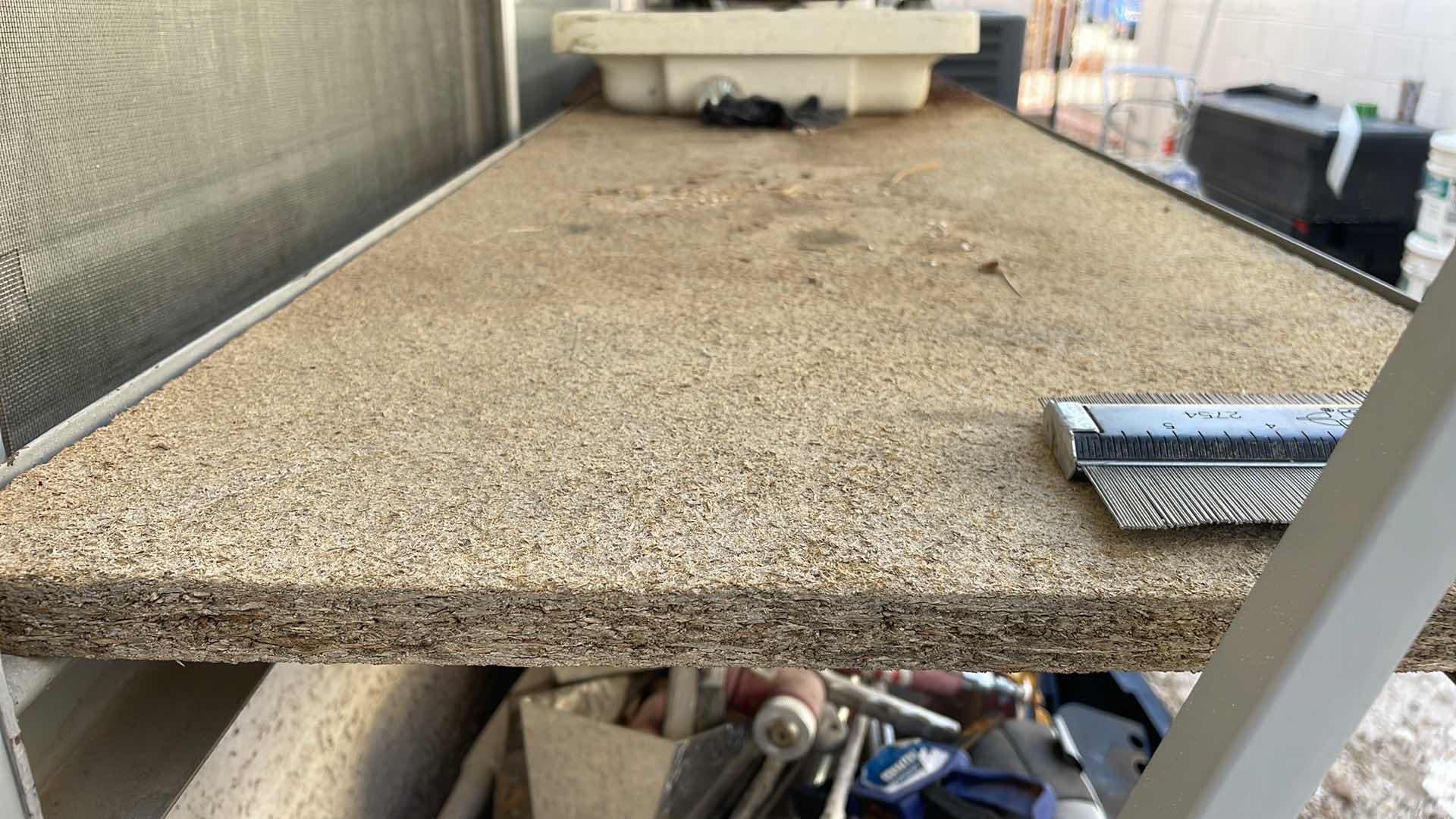 Photo 1 of HEAVYDUTY METAL RACK WOOD IS BAD WILL NEED NEW SHELVES CONTENTS NOT INCLUDED