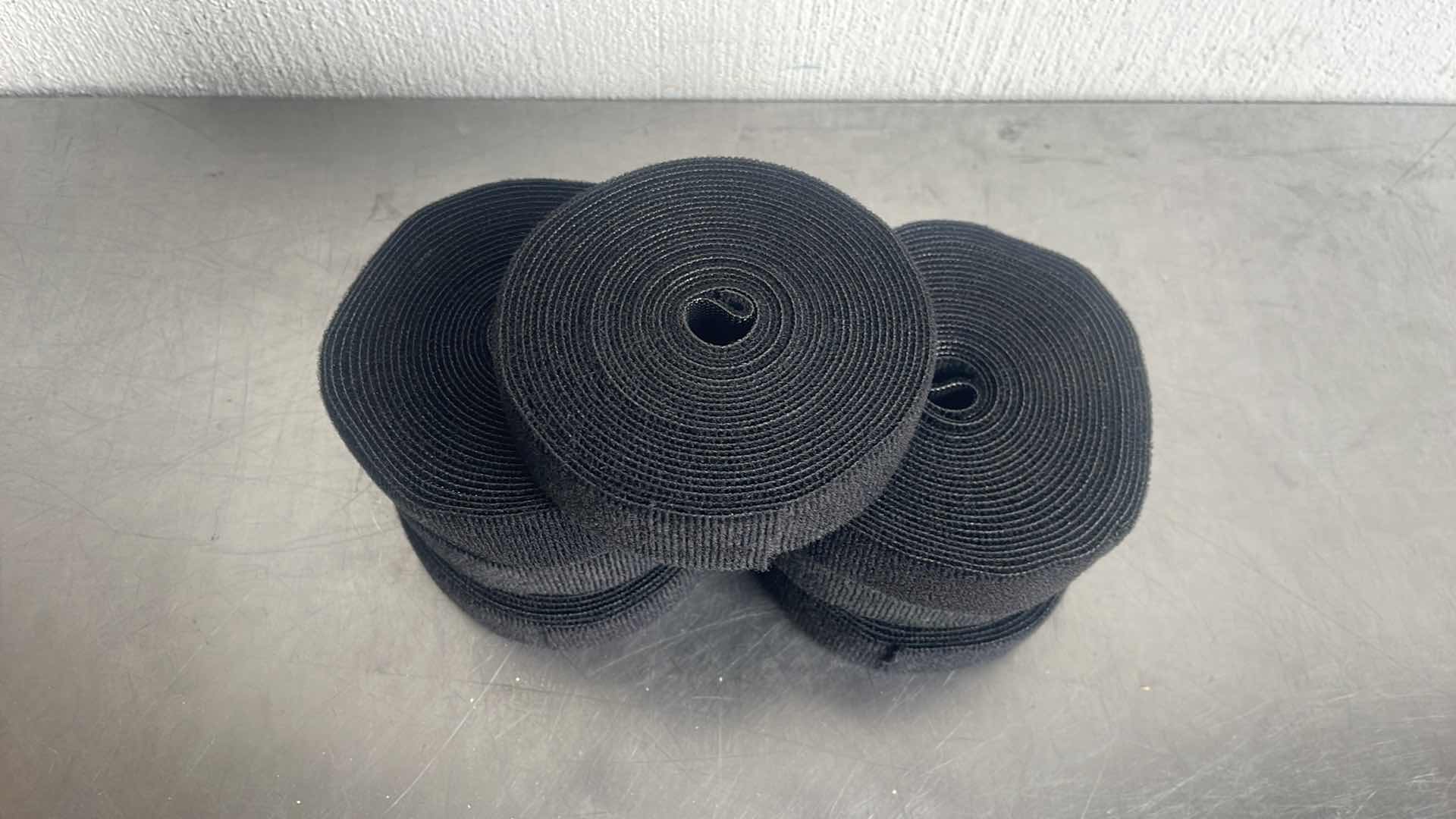 Photo 1 of HOOK AND LOOP TAPE 7 ROLLS UNKNOWN LENGTH PER ROLL