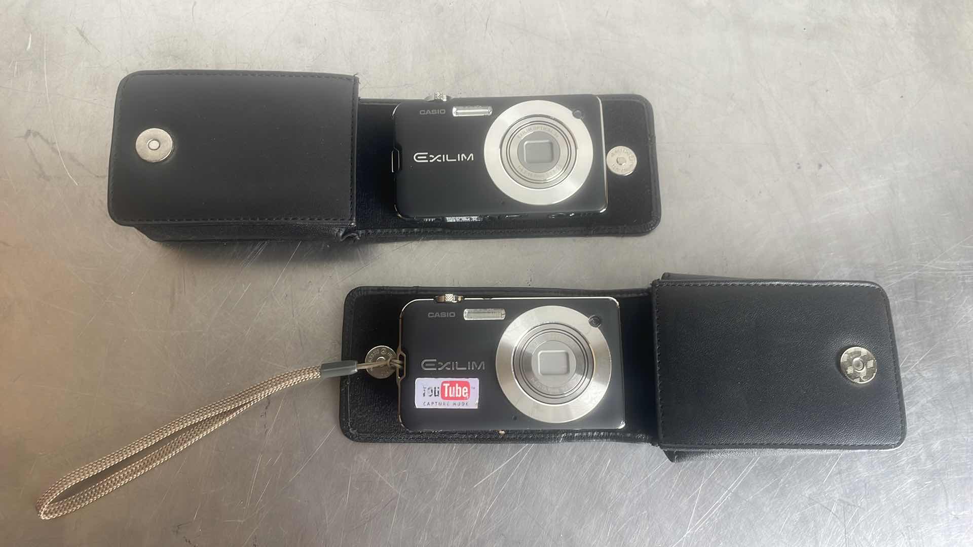 Photo 1 of CASIO EXILIM DIGITAL CAMERAS UNABLE TO TEST. BOTH HAVE BATTERIES NO CABLES TO CHARGE