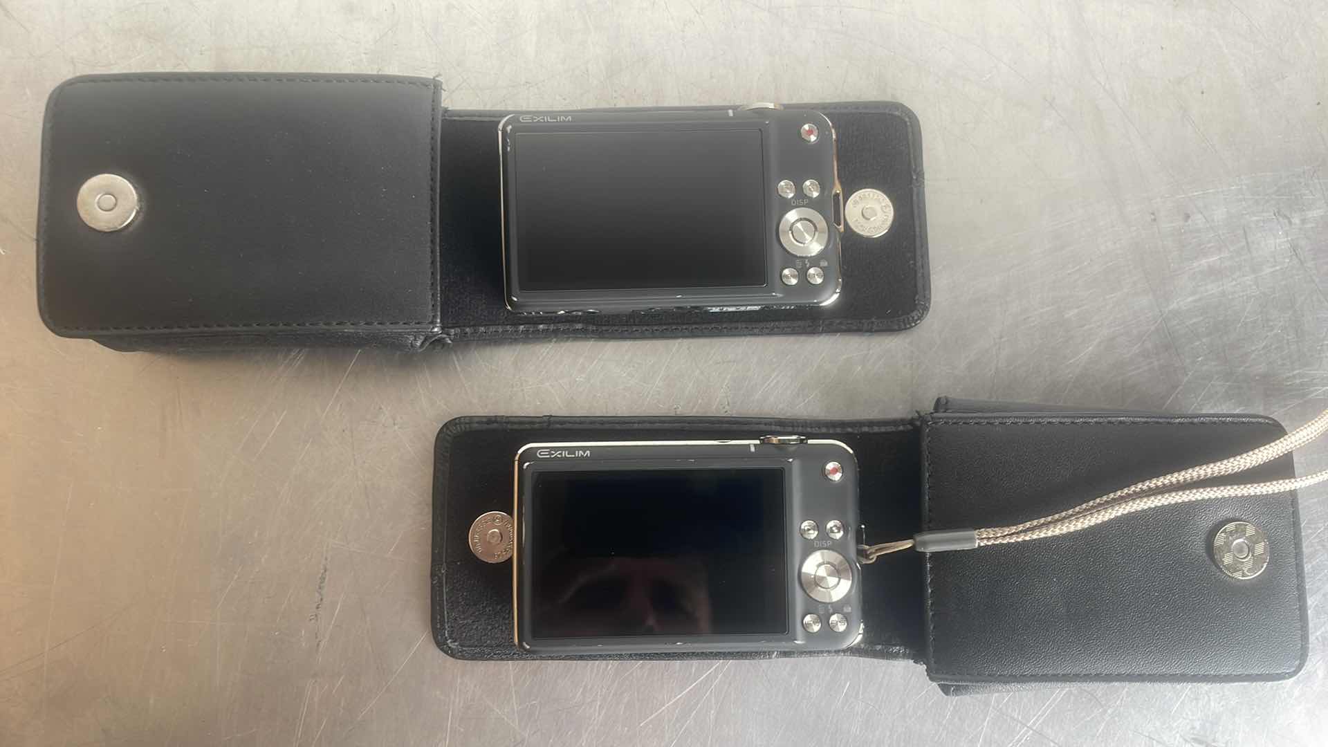 Photo 1 of CASIO EXILIM DIGITAL CAMERAS UNABLE TO TEST. BOTH HAVE BATTERIES NO CABLES TO CHARGE