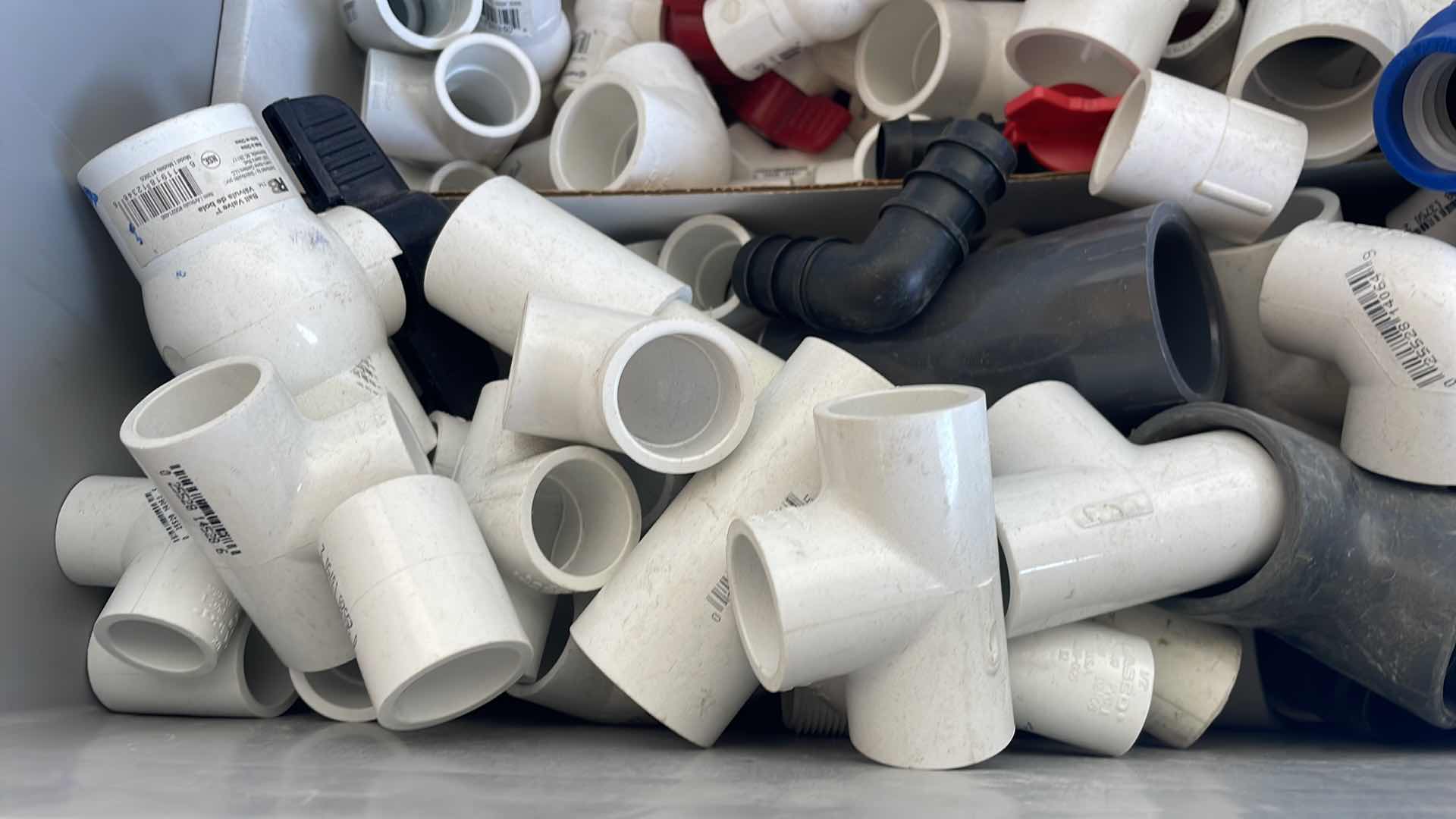 Photo 1 of BOXPLUS 24”x16”x17” FULL OF VARIOUS PVC TEES, ELBOWS, JUNCTIONS,  VALVES